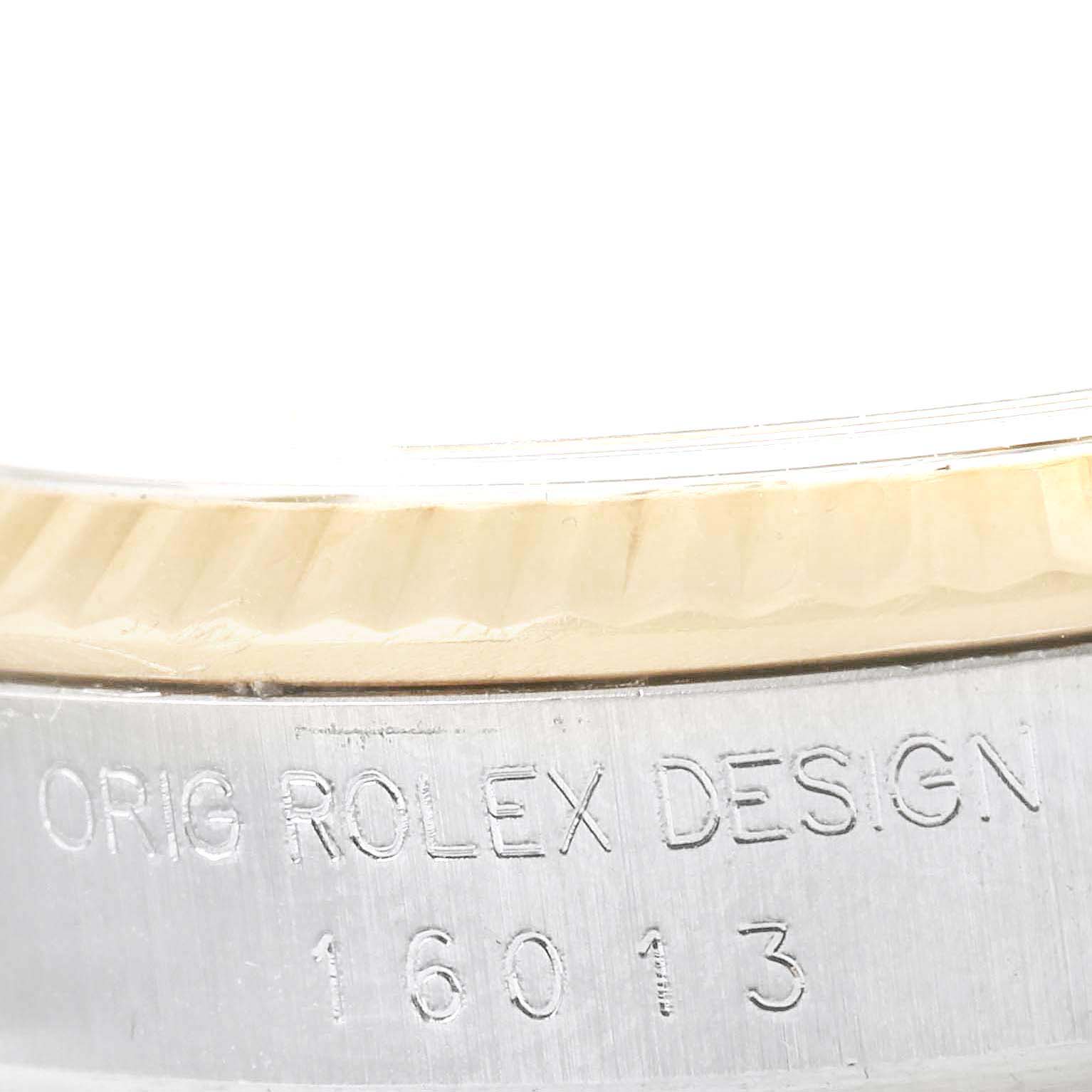 This close-up image shows the engraved model number and part of the bezel of the Vintage Collection Rolex watch.