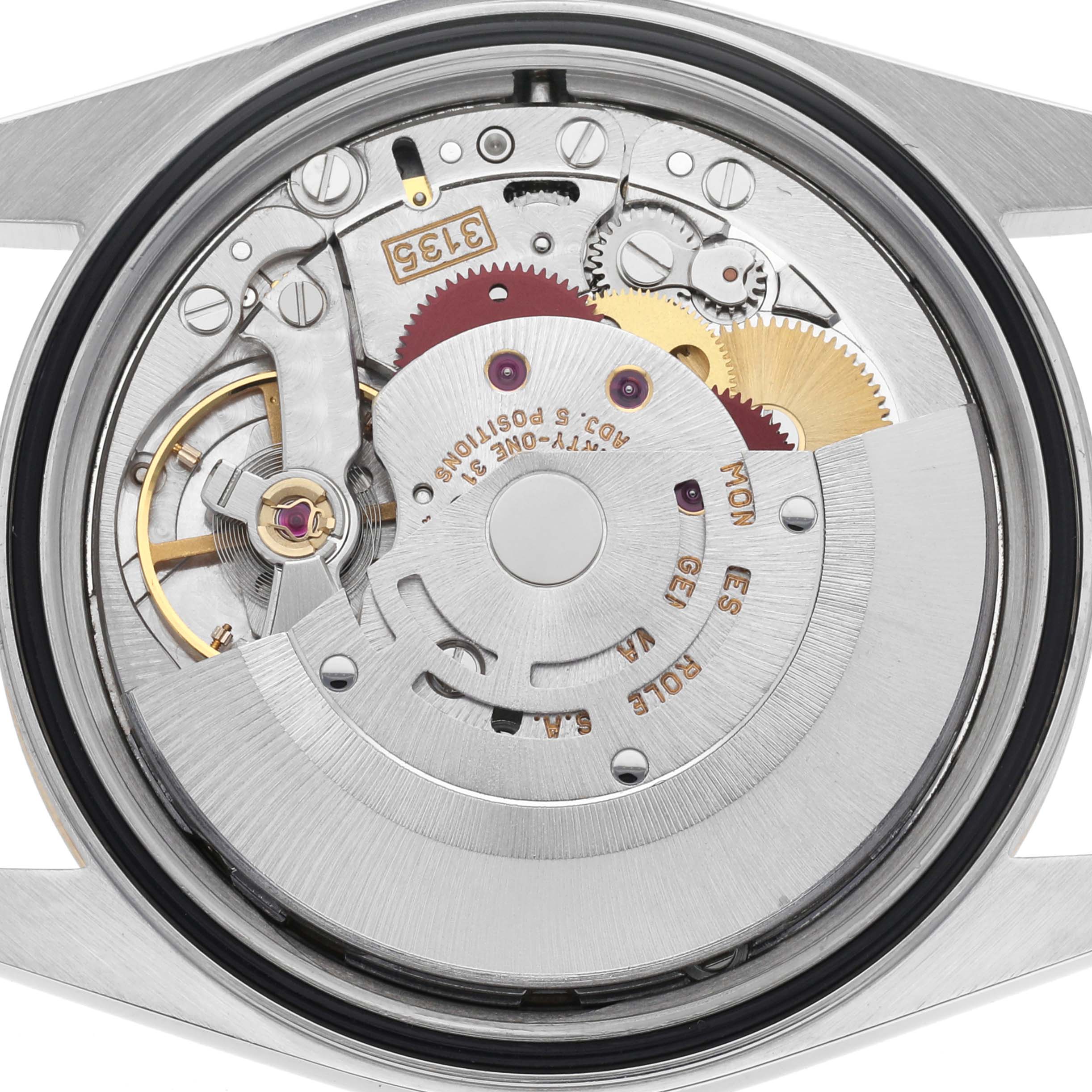 The image shows the movement of a Rolex Datejust 16233 Men
s Steel and Gold (two tone) Champagne Dial 16233 Men
s Steel and Gold (two tone) Champagne Dial, viewed from the back, highlighting gears and mechanical components.