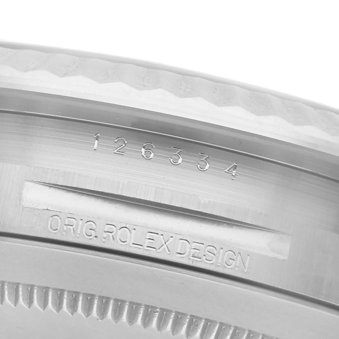 The image shows a close-up of a Rolex Datejust 41 126334 Men
s Stainless Steel Blue Dial 126334 Men
s Stainless Steel Blue Dial case side, highlighting the model number and "Orig. Rolex Design" engraving.