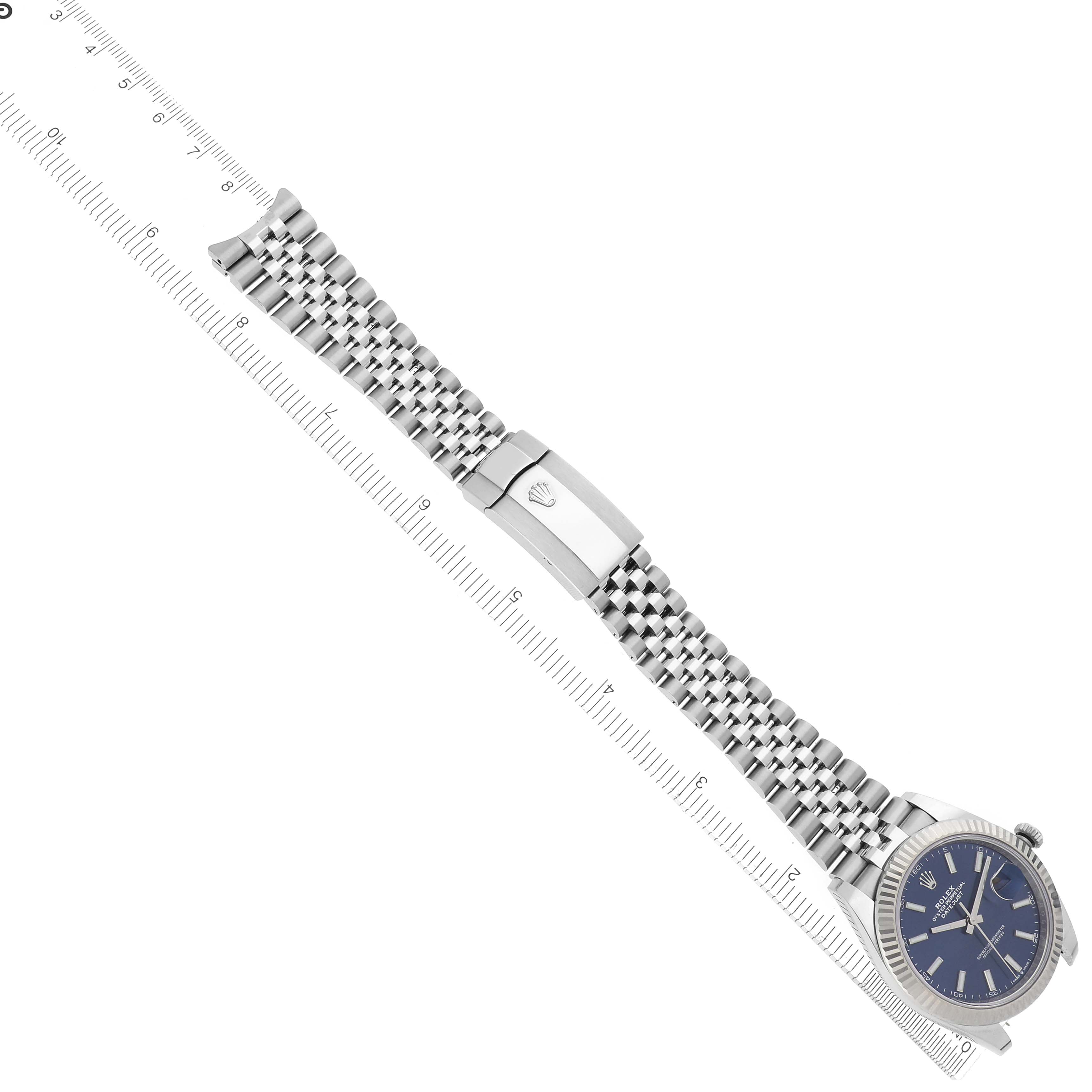 The Rolex Datejust 41 126334 Men
s Stainless Steel Blue Dial 126334 Men
s Stainless Steel Blue Dial is shown from a top view, displaying the watch face, bracelet, clasp, and bezel.