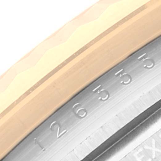This close-up image of the Rolex Datejust 41 126333 Men's Steel and Gold (two tone) Champagne Dial 126333 Men's Steel and Gold (two tone) Champagne Dial model shows part of the bezel and outer ring with engraved numbers.