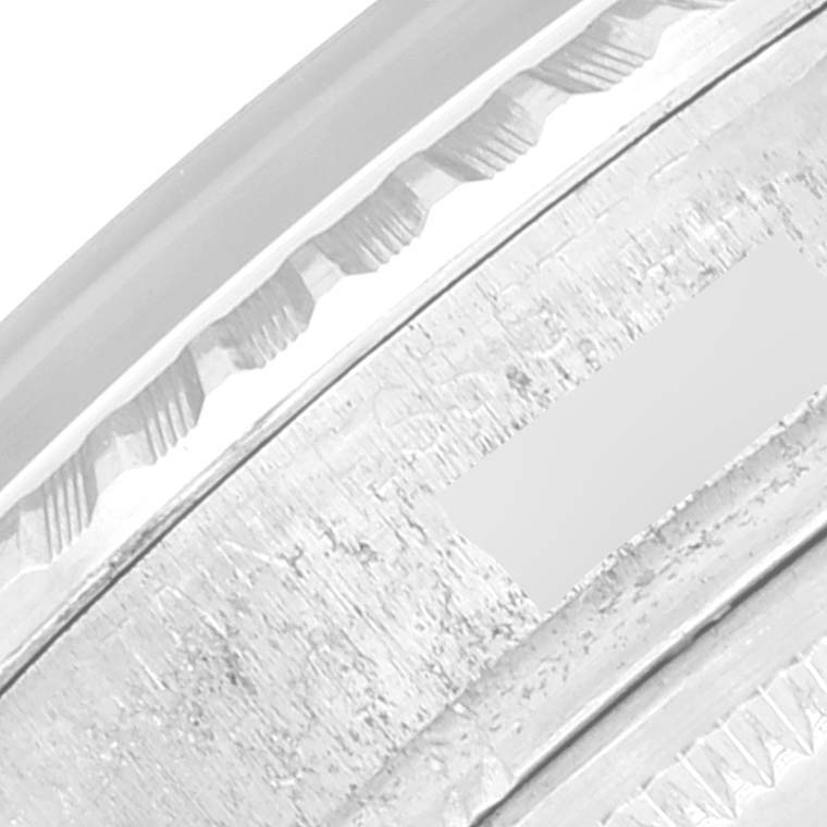 The image shows a close-up view of the bezel and part of the case of a Rolex Vintage Collection 1603 Men's Stainless Steel Silver Dial 1603 Men's Stainless Steel Silver Dial watch.