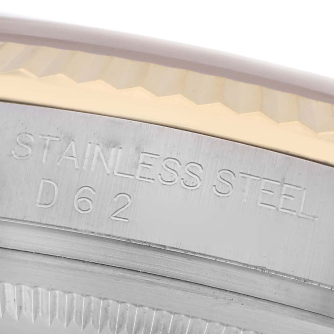 The image shows a close-up of a Rolex Datejust 116233 Men
s Steel and Gold (two tone) White Dial 116233 Men
s Steel and Gold (two tone) White Dial watch, focusing on the engraved stainless steel case side.