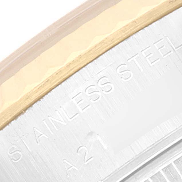 The image shows a close-up of the stainless steel and gold bezel of a Rolex Datejust 79173 Women's Steel and Gold (two tone) White Dial 79173 Women's Steel and Gold (two tone) White Dial watch.