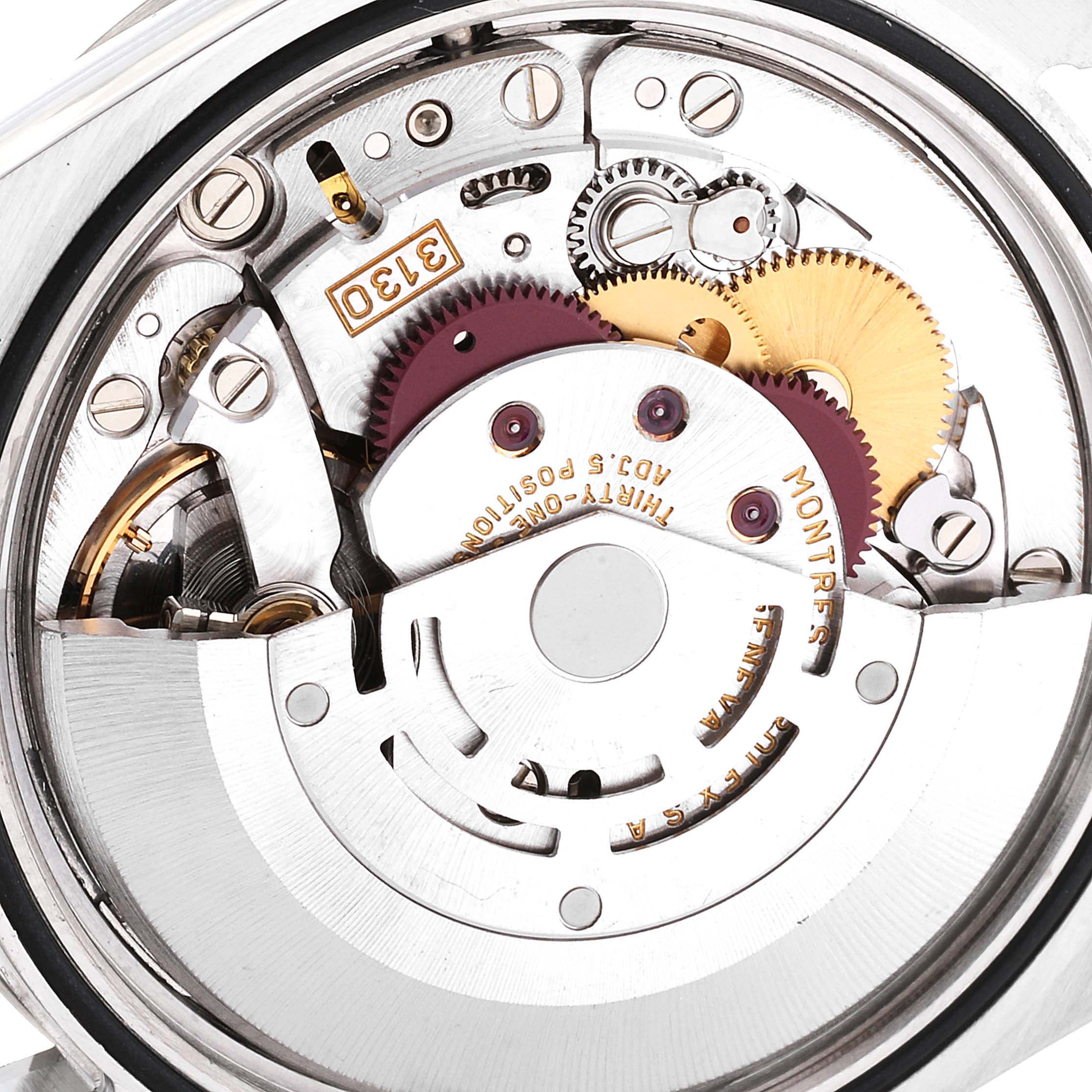 The image shows the intricate backside and internal mechanical movements of a Rolex Explorer 114270 Men
s Stainless Steel Black Dial 114270 Men
s Stainless Steel Black Dial watch.