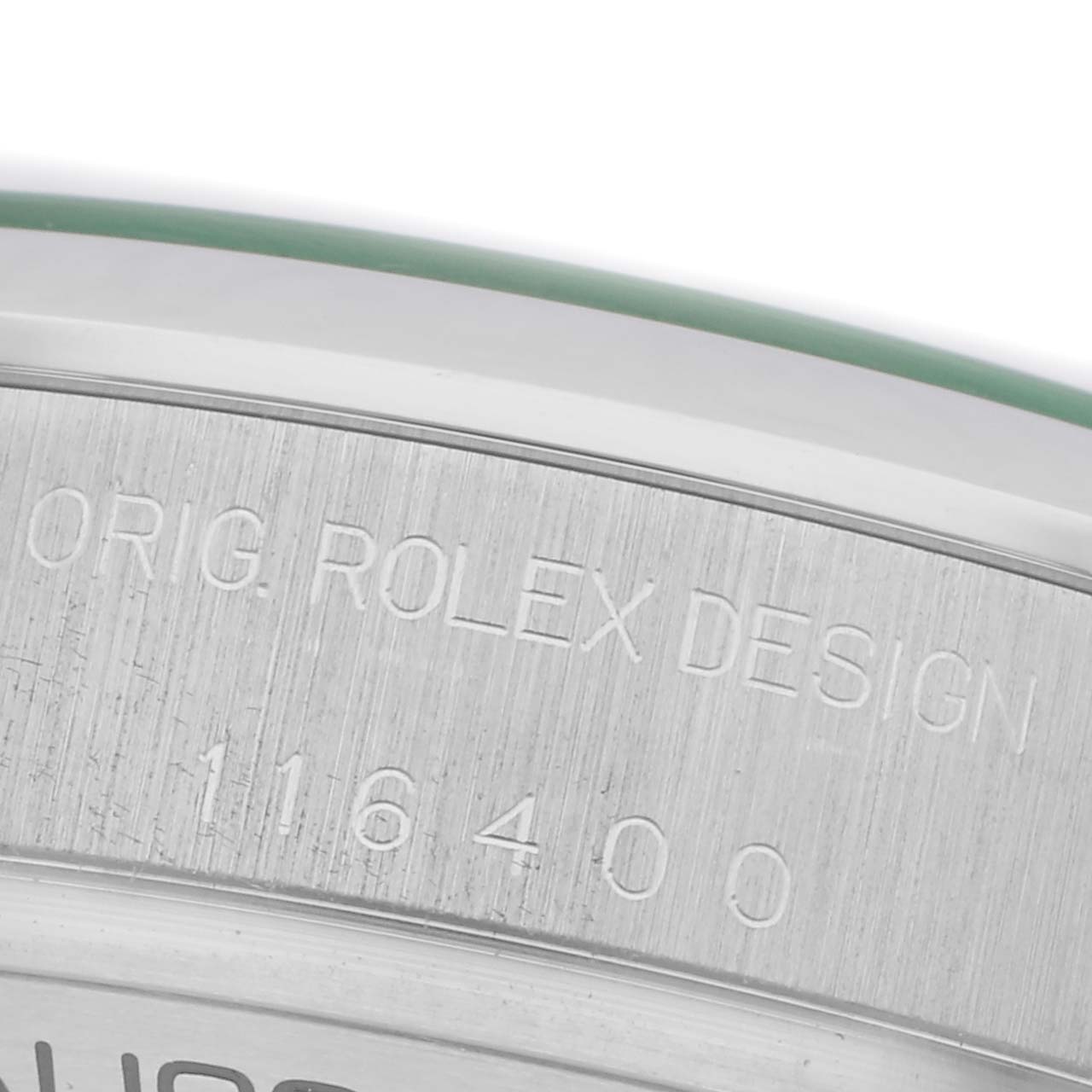 The image shows a close-up of the bezel engraving on a Rolex Milgauss 116400GV Men
s Stainless Steel Black Dial 116400GV Men
s Stainless Steel Black Dial watch.