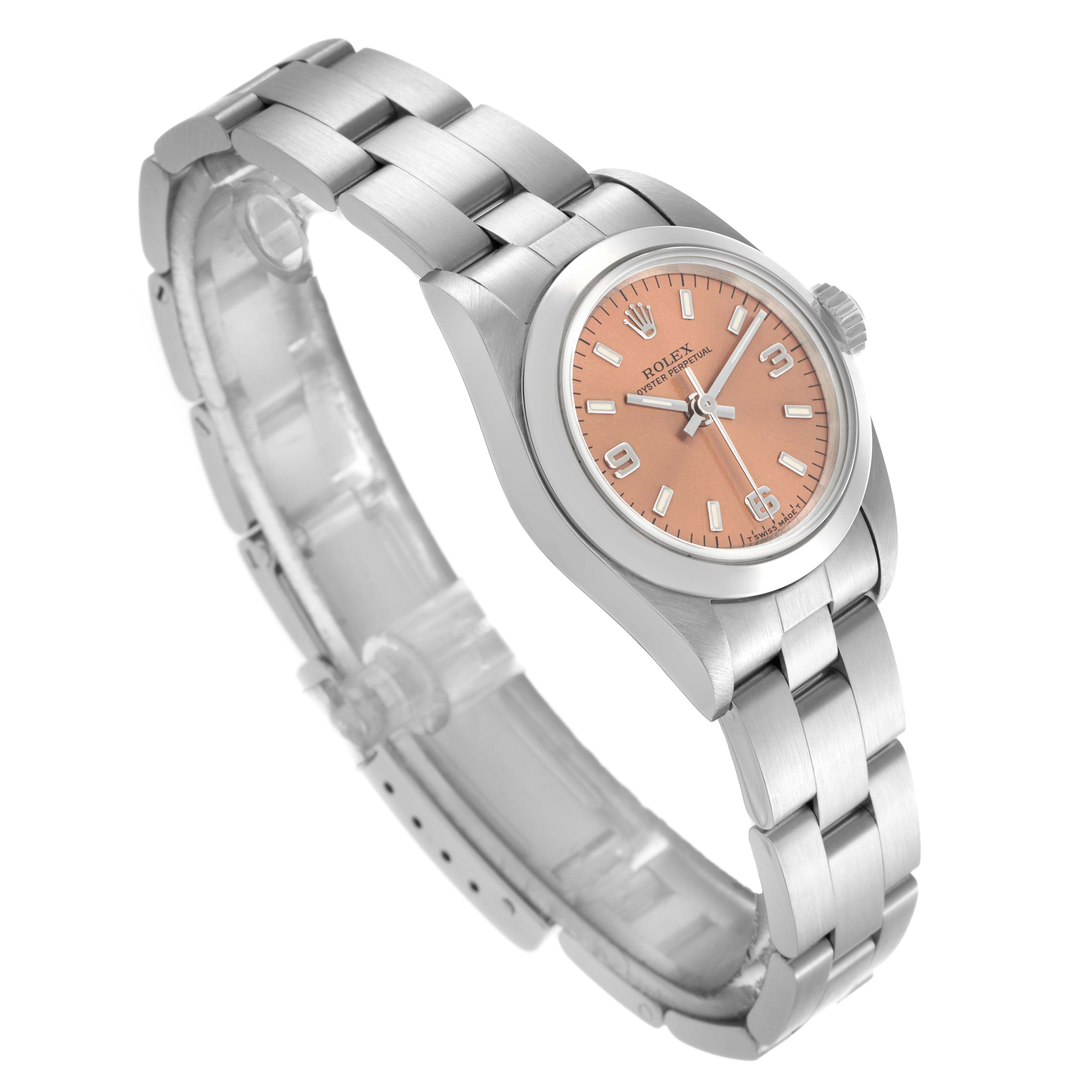 The Rolex Oyster Perpetual 67180 Women's Stainless Steel Pink Dial 67180 Women's Stainless Steel Pink Dial watch is shown at an angled view, highlighting its bracelet, case, crown, and salmon-colored dial.