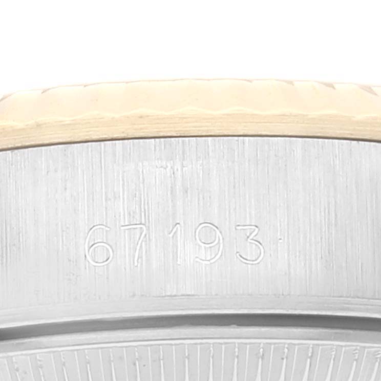 The image shows a close-up of the caseback edge of a Rolex Oyster Perpetual 67193 Women's Steel and Gold (two tone) Champagne Dial 67193 Women's Steel and Gold (two tone) Champagne Dial, revealing the engraving "67193."