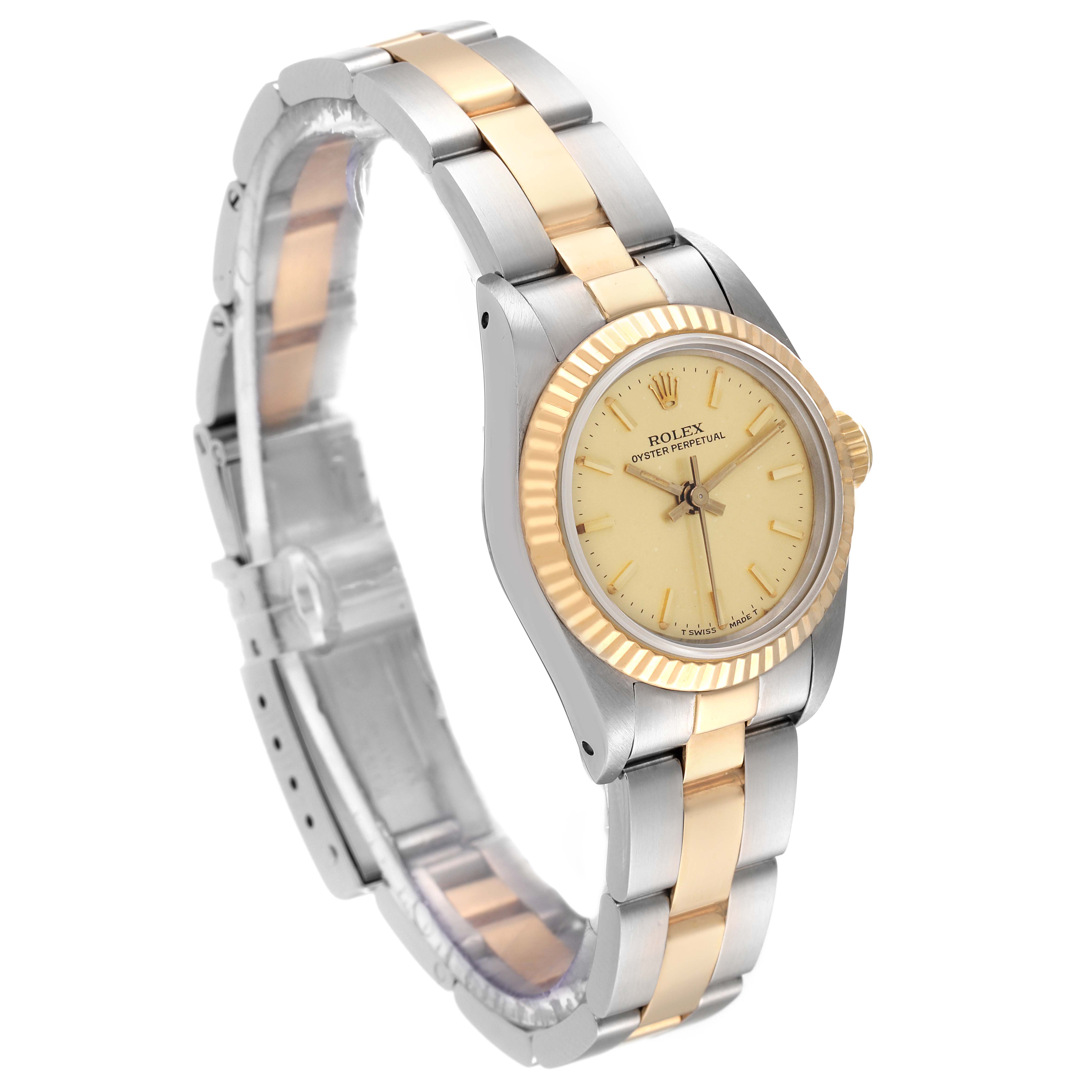 This image shows a side angle of a Rolex Oyster Perpetual 67193 Women's Steel and Gold (two tone) Champagne Dial 67193 Women's Steel and Gold (two tone) Champagne Dial watch, highlighting the two-tone bracelet and dial.