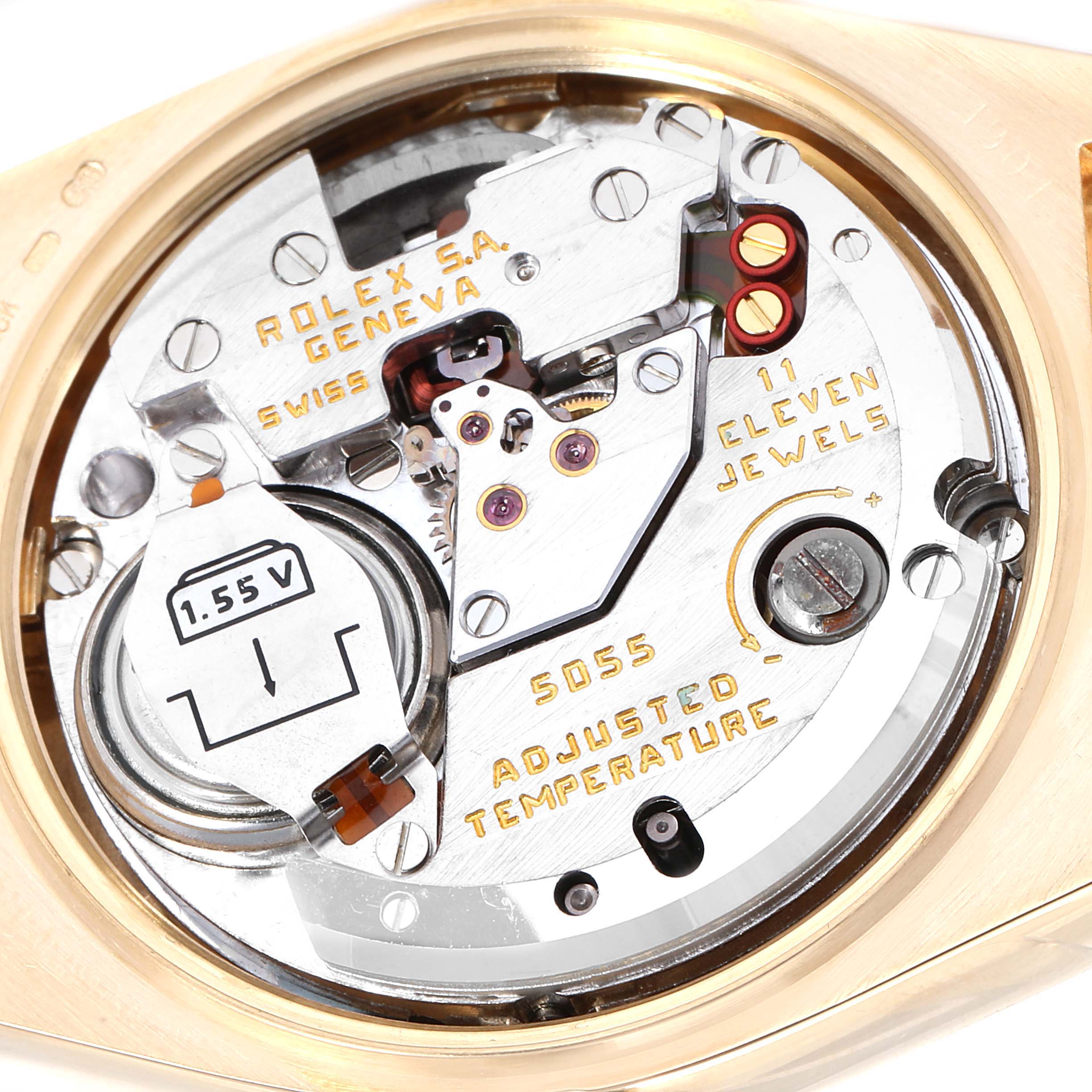 The image shows the internal mechanism of a Rolex President 19018 Men's Yellow Gold Champagne Dial 19018 Men's Yellow Gold Champagne Dial model watch, highlighting its movement and battery at a close angle.