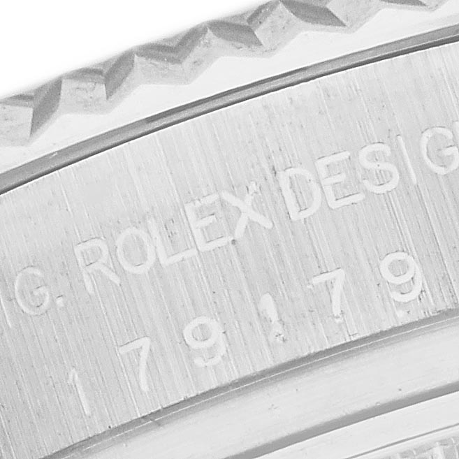 The image shows a close-up of the case edge and engraved details on a Rolex President 179179 Women's White Gold Mother of Pearl Dial 179179 Women's White Gold Mother of Pearl Dial model watch.
