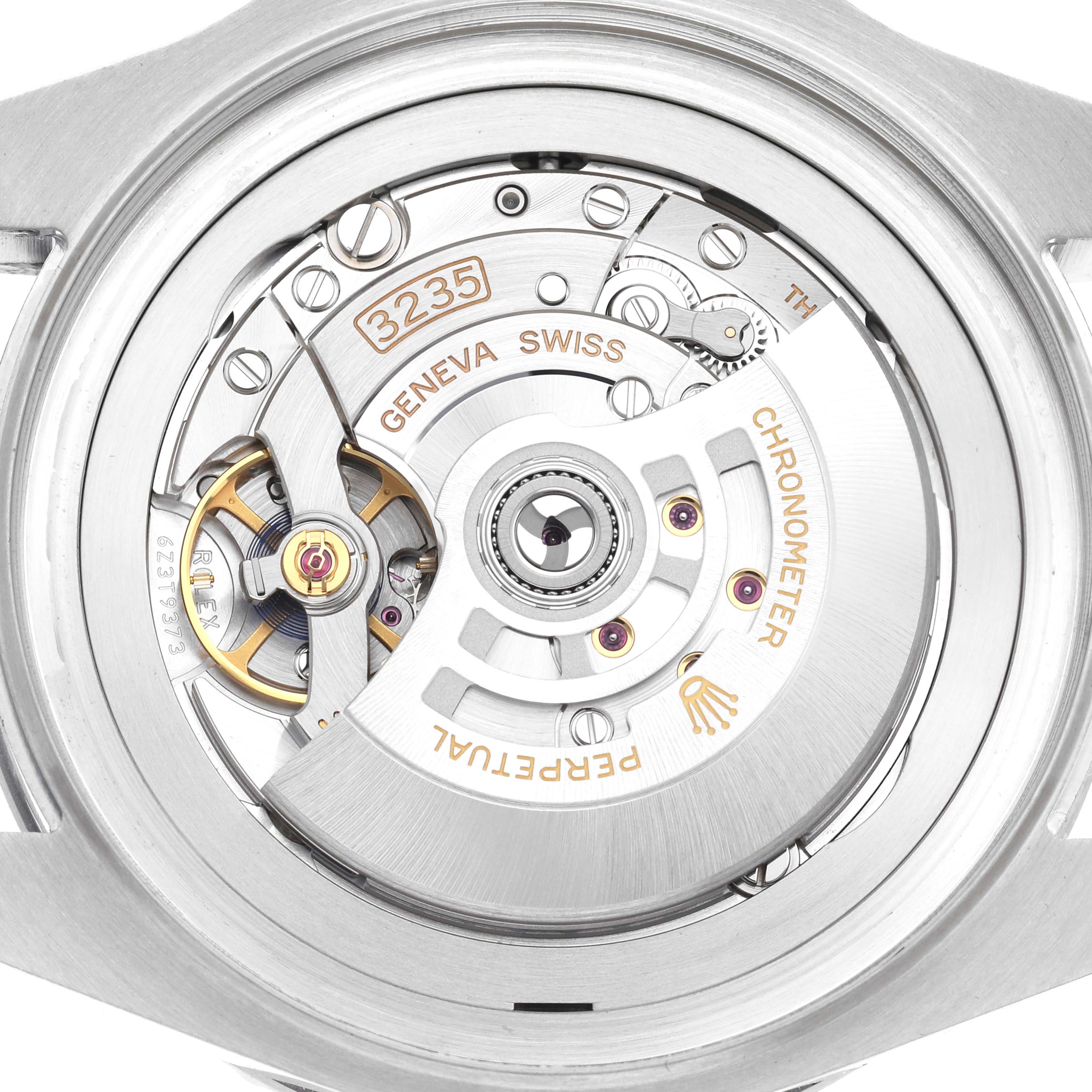 The image shows the back of a Rolex Sea-Dweller 136660 Men
s Stainless Steel Black Dial 136660 Men
s Stainless Steel Black Dial, highlighting its movement and intricate mechanical parts.