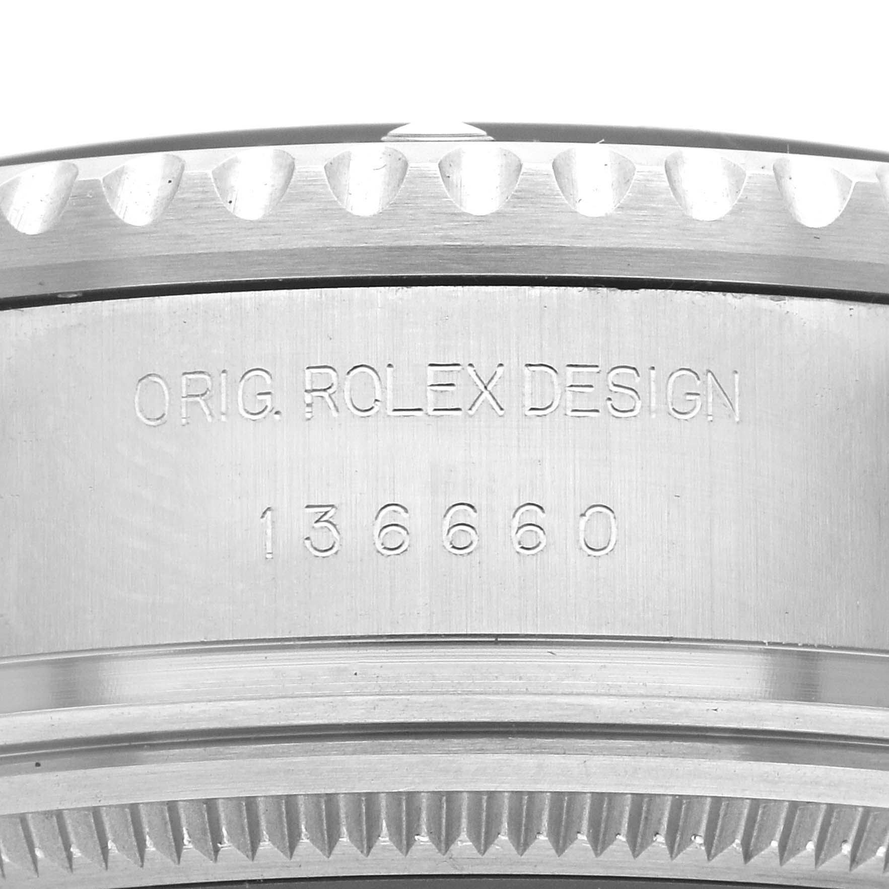 The image shows a close-up of the Rolex Sea-Dweller 136660 Men
s Stainless Steel Black Dial 136660 Men
s Stainless Steel Black Dial
s side, featuring the "ORIG. ROLEX DESIGN" and model number engravings.