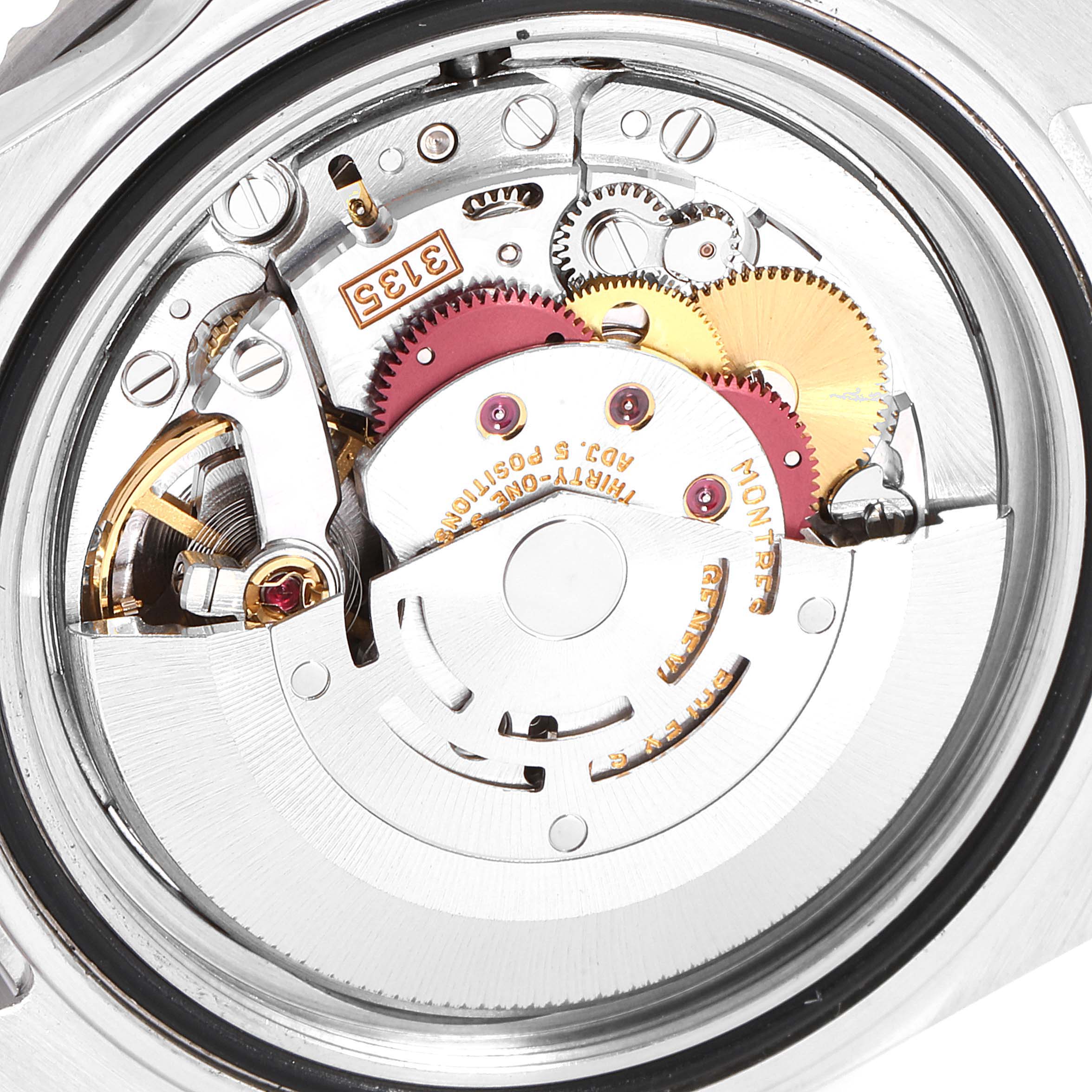 This image shows the inner mechanical movement of the Rolex Submariner 16610 Men
s Stainless Steel Black Dial 16610 Men
s Stainless Steel Black Dial watch, including gears and components.