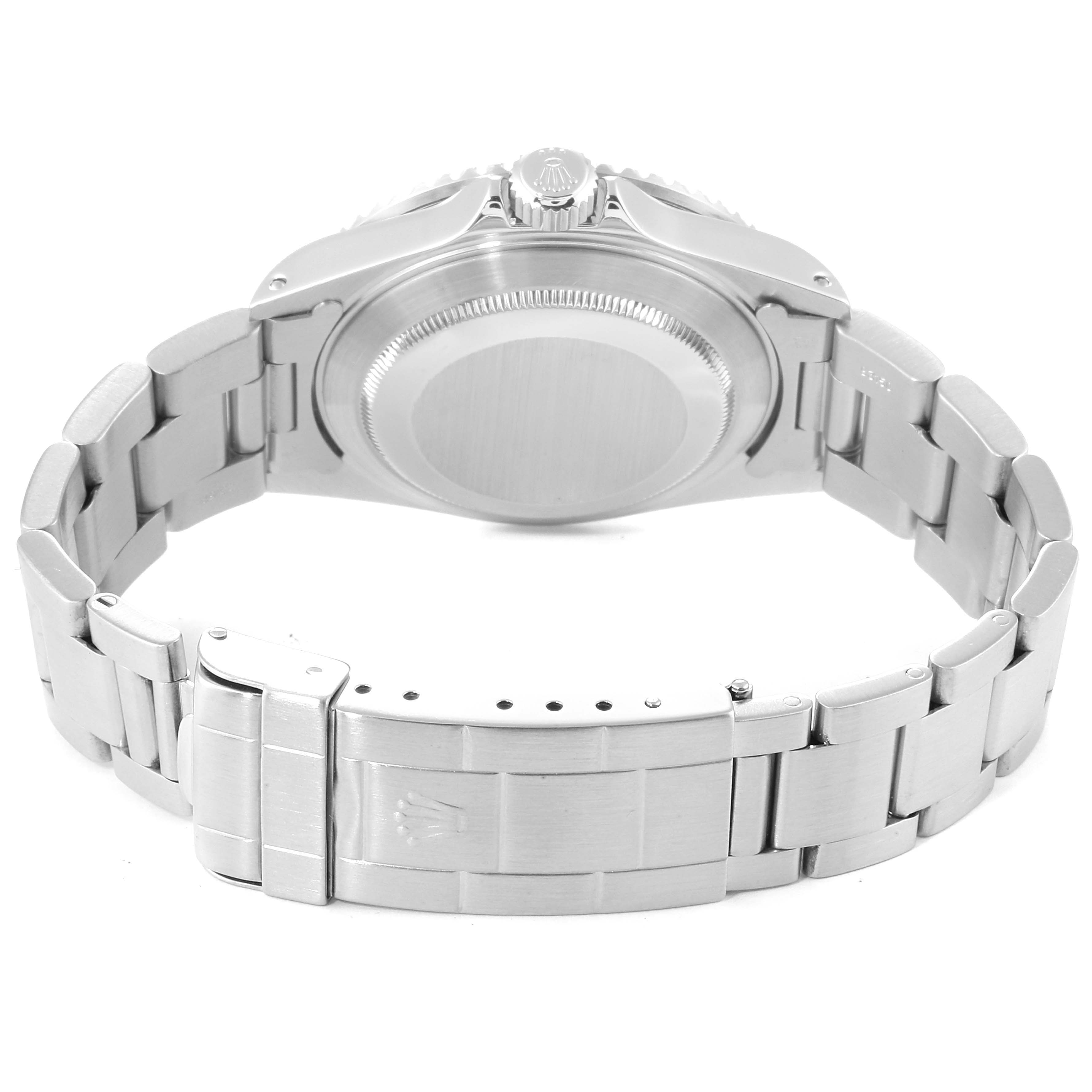 The image shows the back view of a Rolex Submariner 16610 Men
s Stainless Steel Black Dial 16610 Men
s Stainless Steel Black Dial watch, highlighting its case back, bracelet, and clasp.