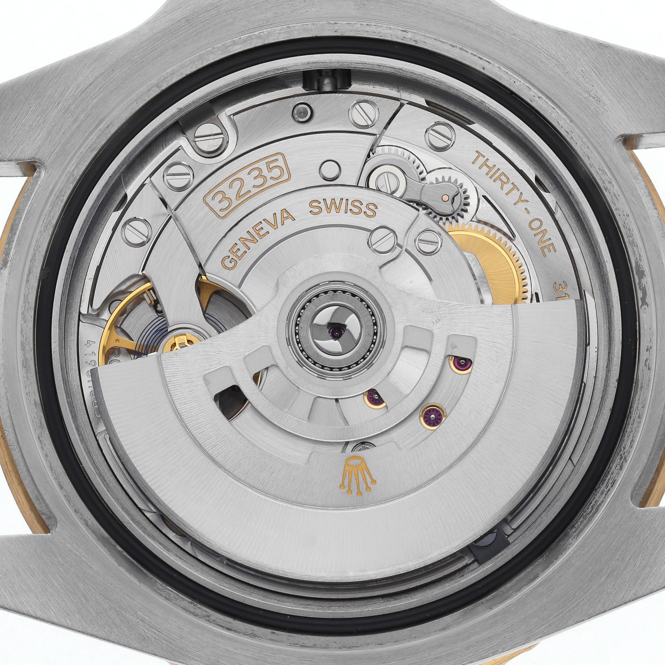 The image shows the internal mechanism of the Rolex Submariner 126613 Men
s Steel and Gold (two tone) Blue Dial 126613 Men
s Steel and Gold (two tone) Blue Dial watch, focusing on the movement and rotor from the back.