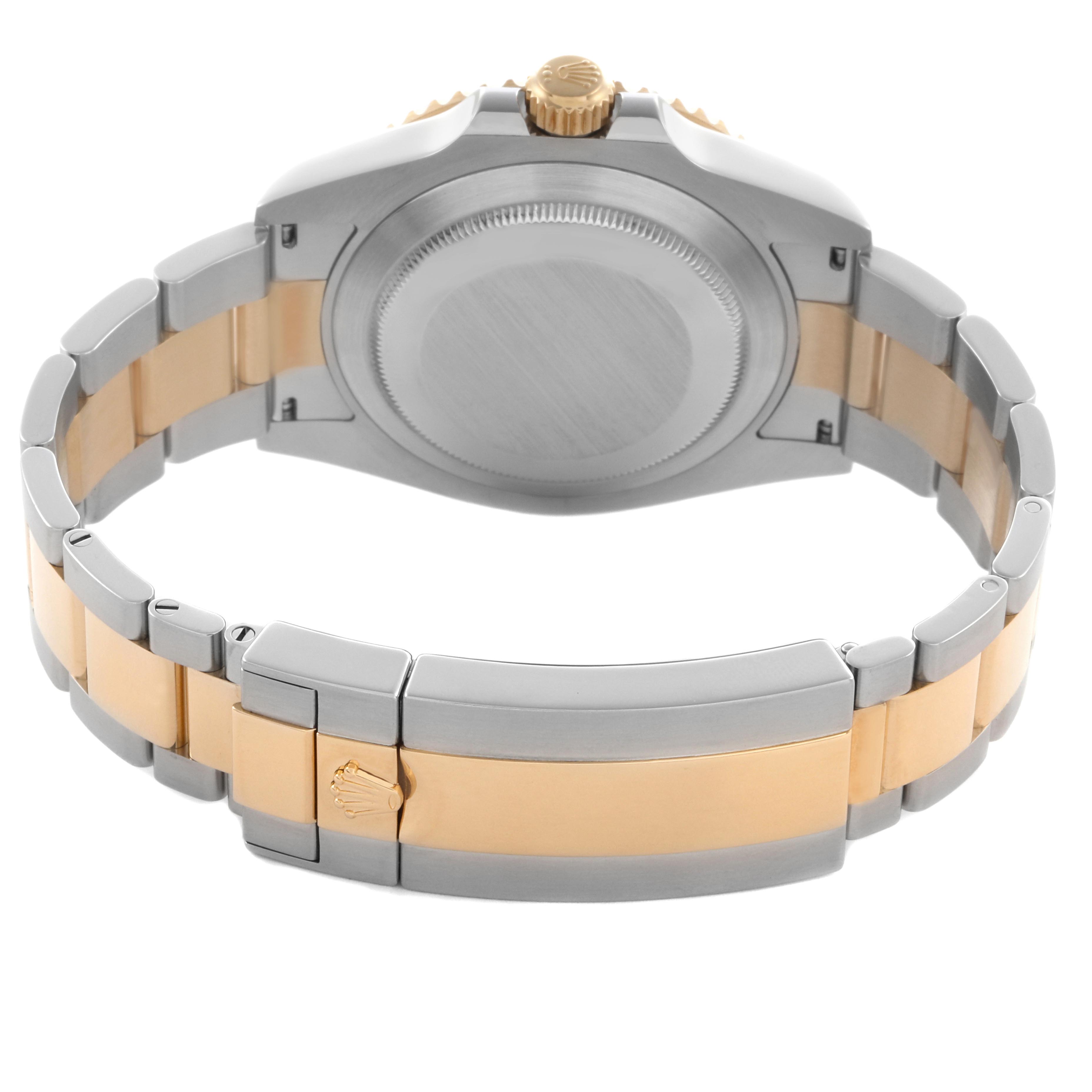 The image shows the back view of a Rolex Submariner 126613 Men
s Steel and Gold (two tone) Blue Dial 126613 Men
s Steel and Gold (two tone) Blue Dial, highlighting the case back and two-tone bracelet with the clasp open.