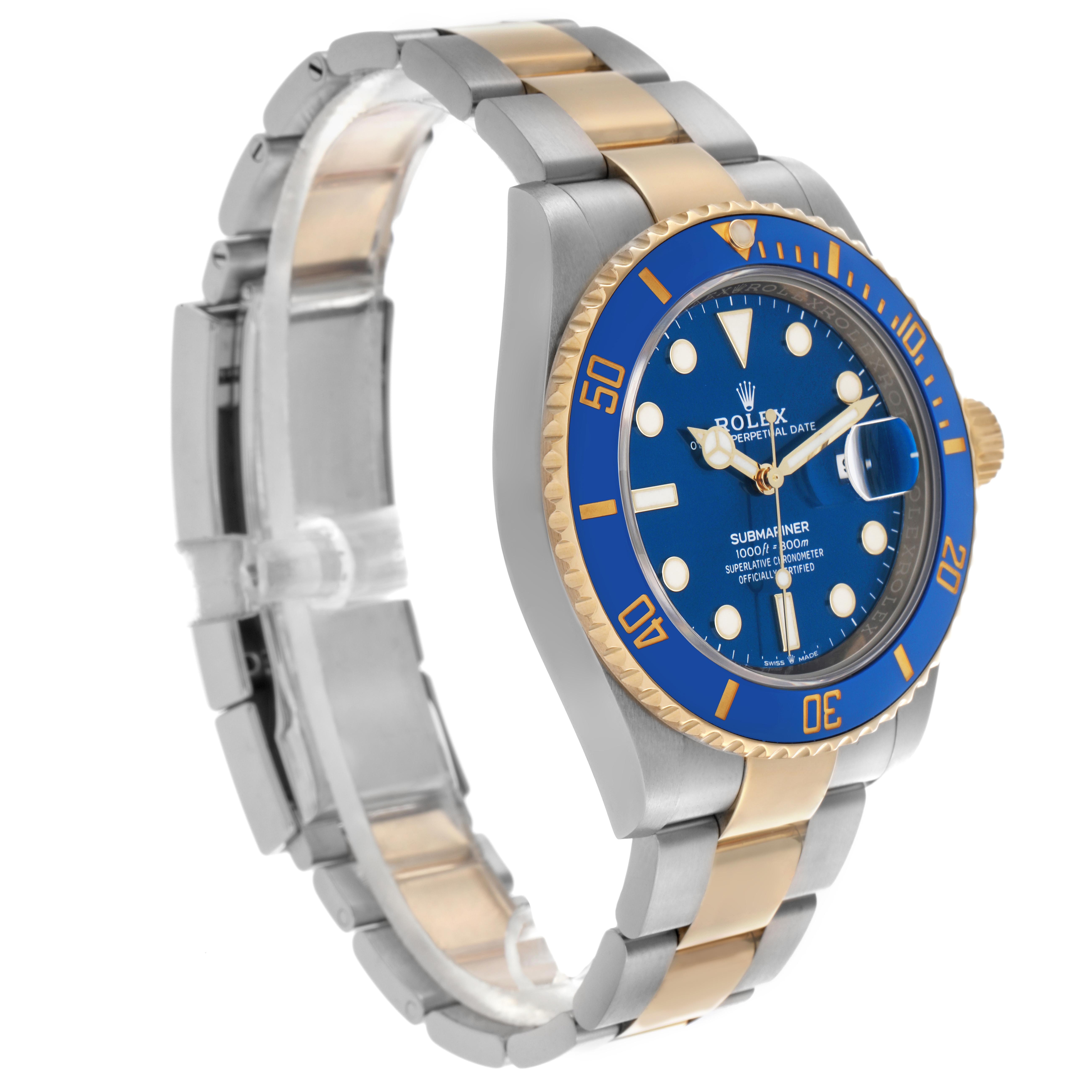 The Rolex Submariner 126613 Men
s Steel and Gold (two tone) Blue Dial 126613 Men
s Steel and Gold (two tone) Blue Dial watch is shown at a three-quarter angle, displaying the blue dial, bezel, and two-tone bracelet.