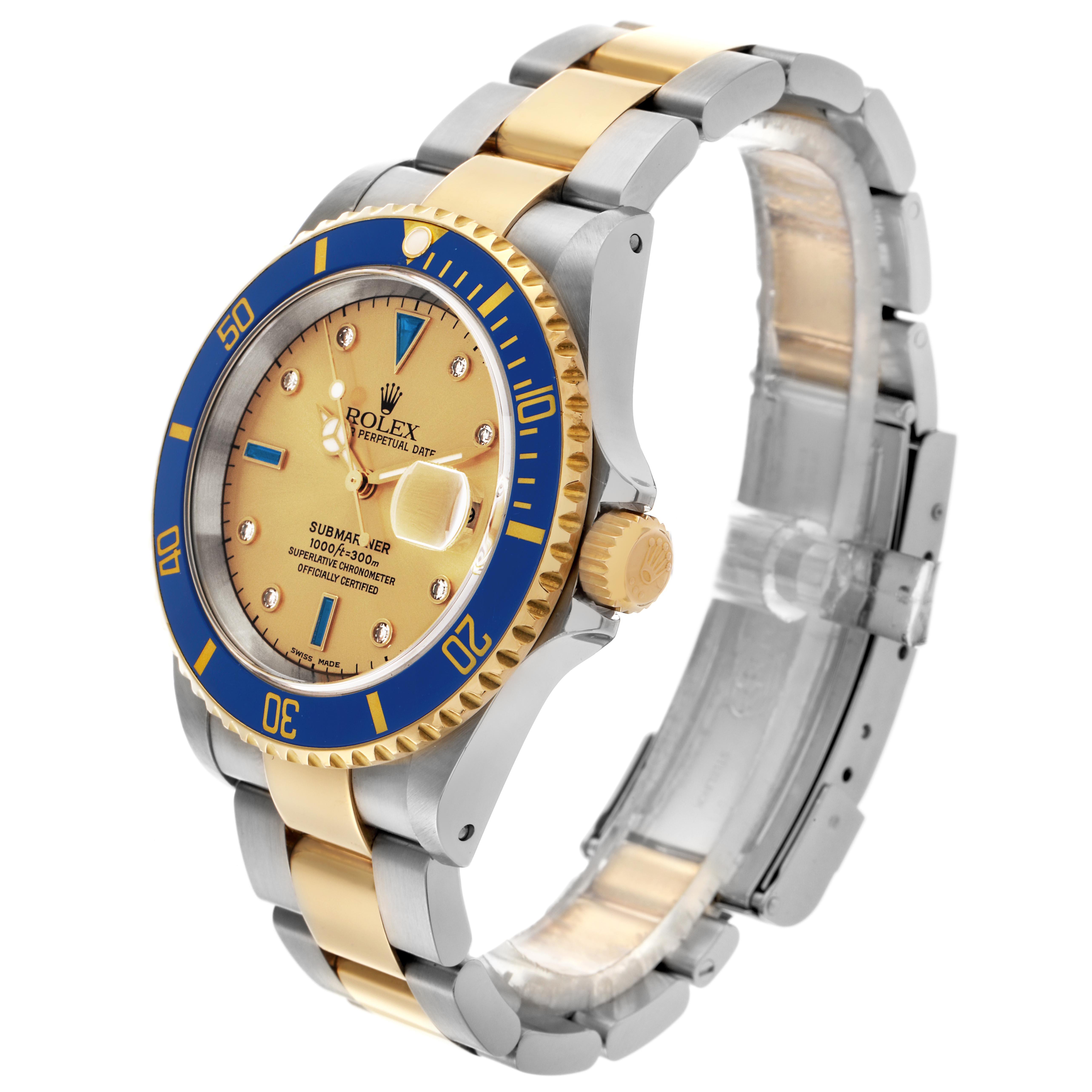The Rolex Submariner 16613 Men
s Steel and Gold (two tone) Champagne Dial 16613 Men
s Steel and Gold (two tone) Champagne Dial watch is shown at an angle highlighting the face, bezel, crown, and two-tone bracelet.
