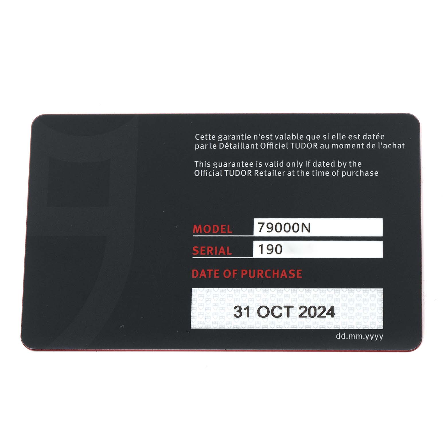 The image shows a warranty card for the Tudor Heritage Black Bay 79000N-0001 Men
s Stainless Steel Black Dial 79000N-0001 Men
s Stainless Steel Black Dial watch model, listing model and serial numbers with a purchase date.