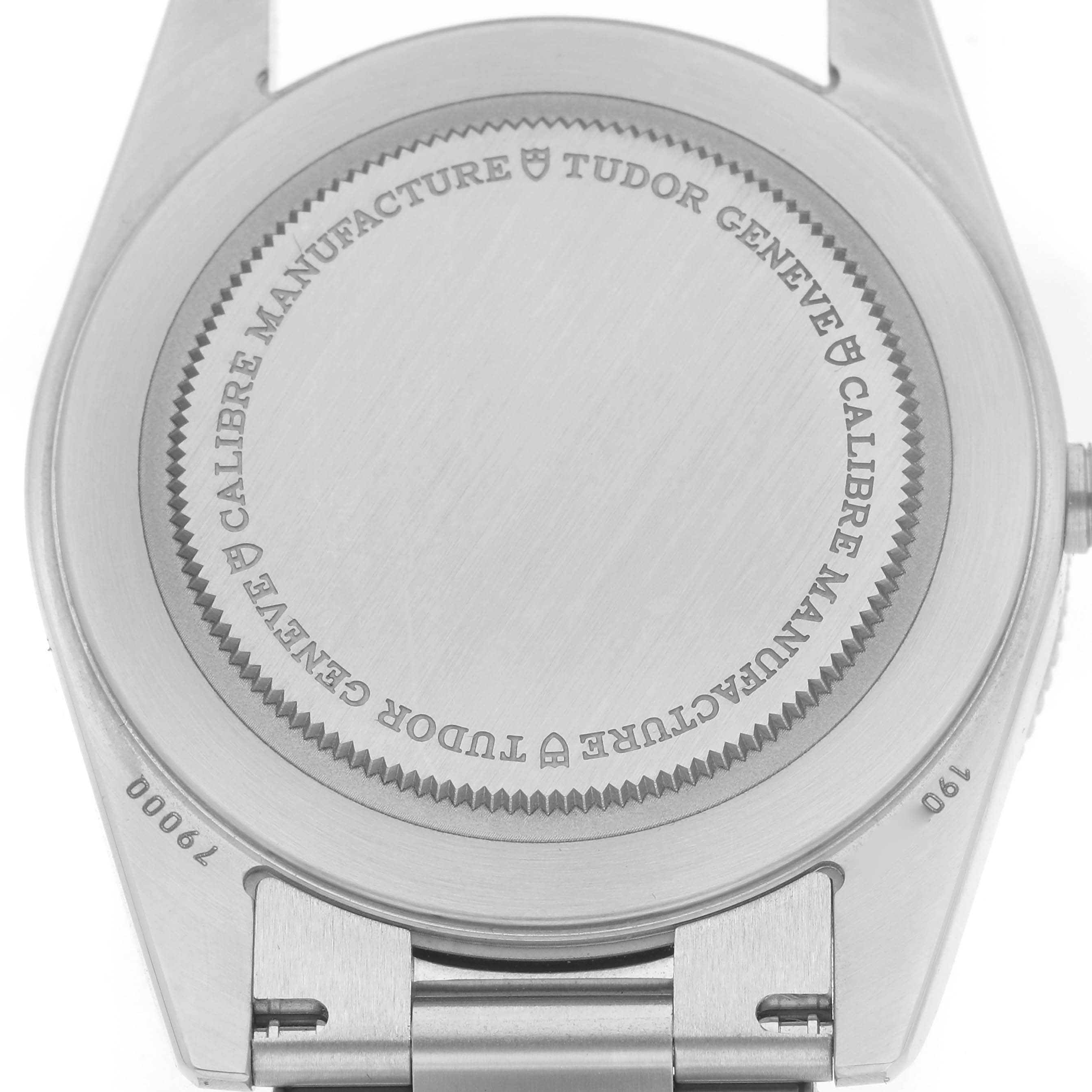 The image shows the back case of a Tudor Heritage Black Bay 79000N-0001 Men
s Stainless Steel Black Dial 79000N-0001 Men
s Stainless Steel Black Dial watch, featuring engraved branding details.