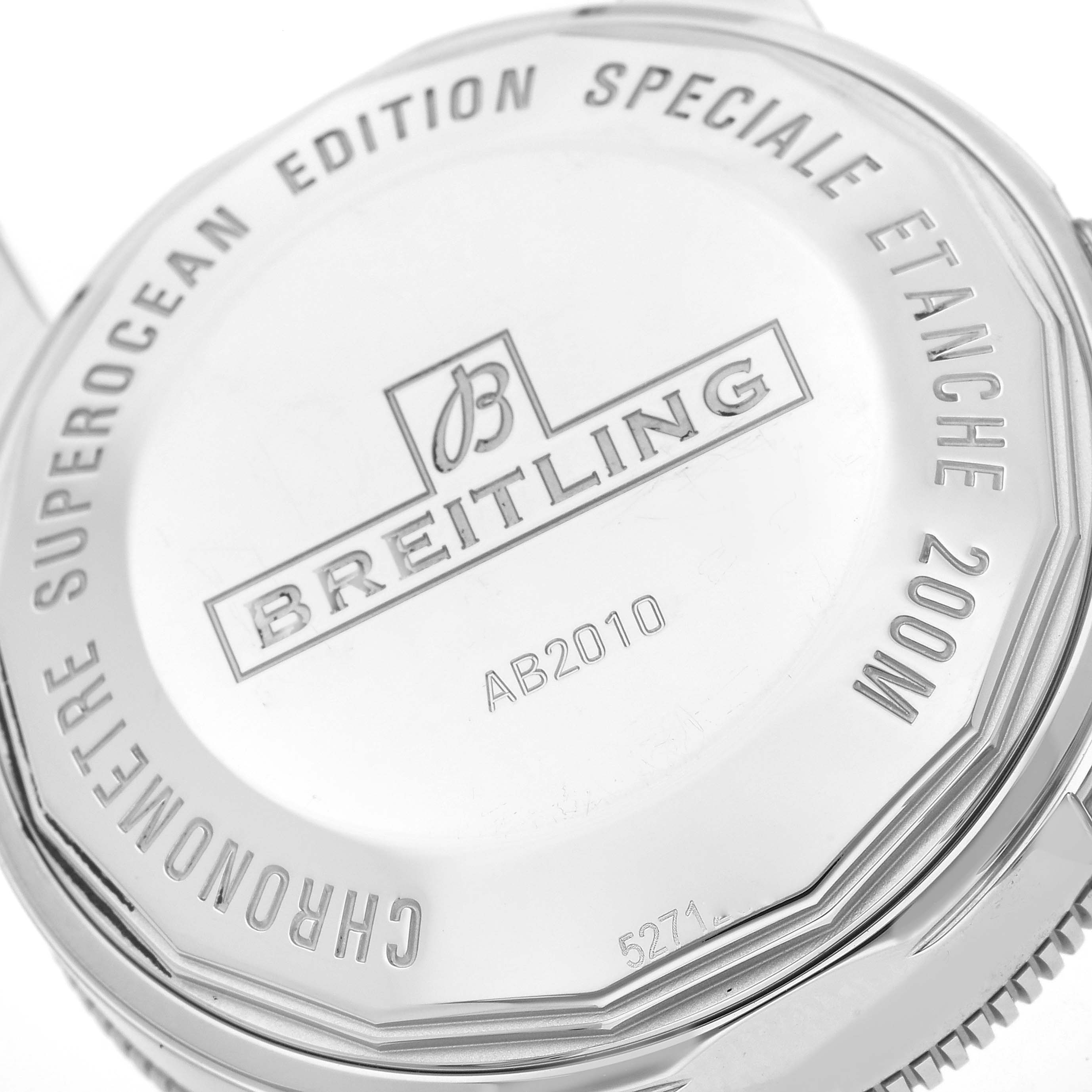 This is a close-up of the back case of a Breitling Superocean AB2010 Men's Stainless Steel Green Dial AB2010 Men's Stainless Steel Green Dial watch, showcasing its engraved details.