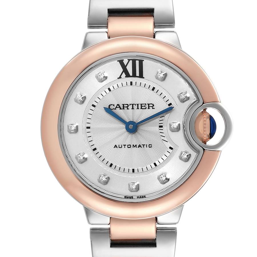 The image shows a Cartier Ballon Bleu watch face, highlighting the dial, crown, and part of the bracelet from a front angle.