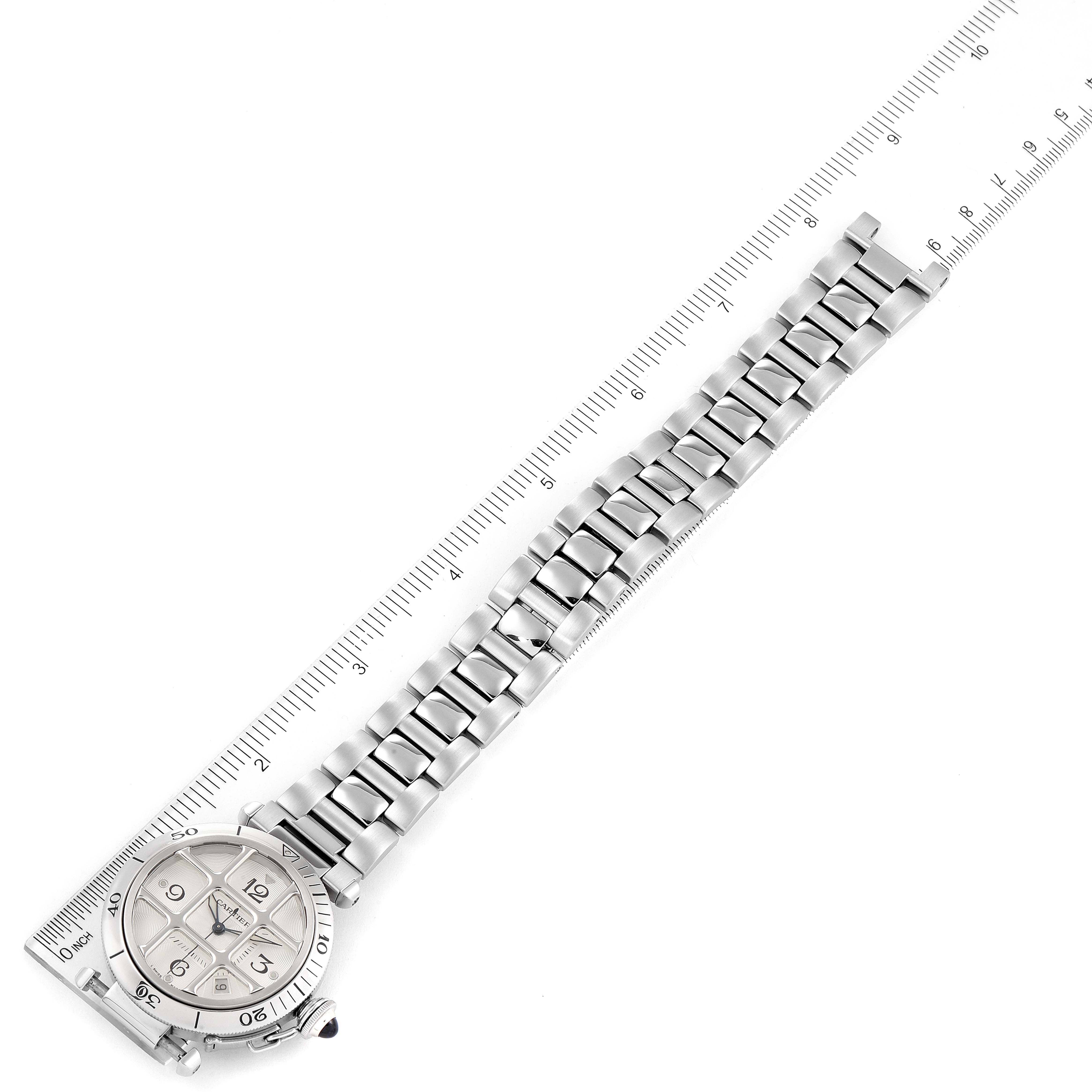 The Cartier Pasha W31040H3 Men
s Stainless Steel Silver Dial W31040H3 Men
s Stainless Steel Silver Dial watch is displayed flat with its steel bracelet stretched along a ruler for measurement.