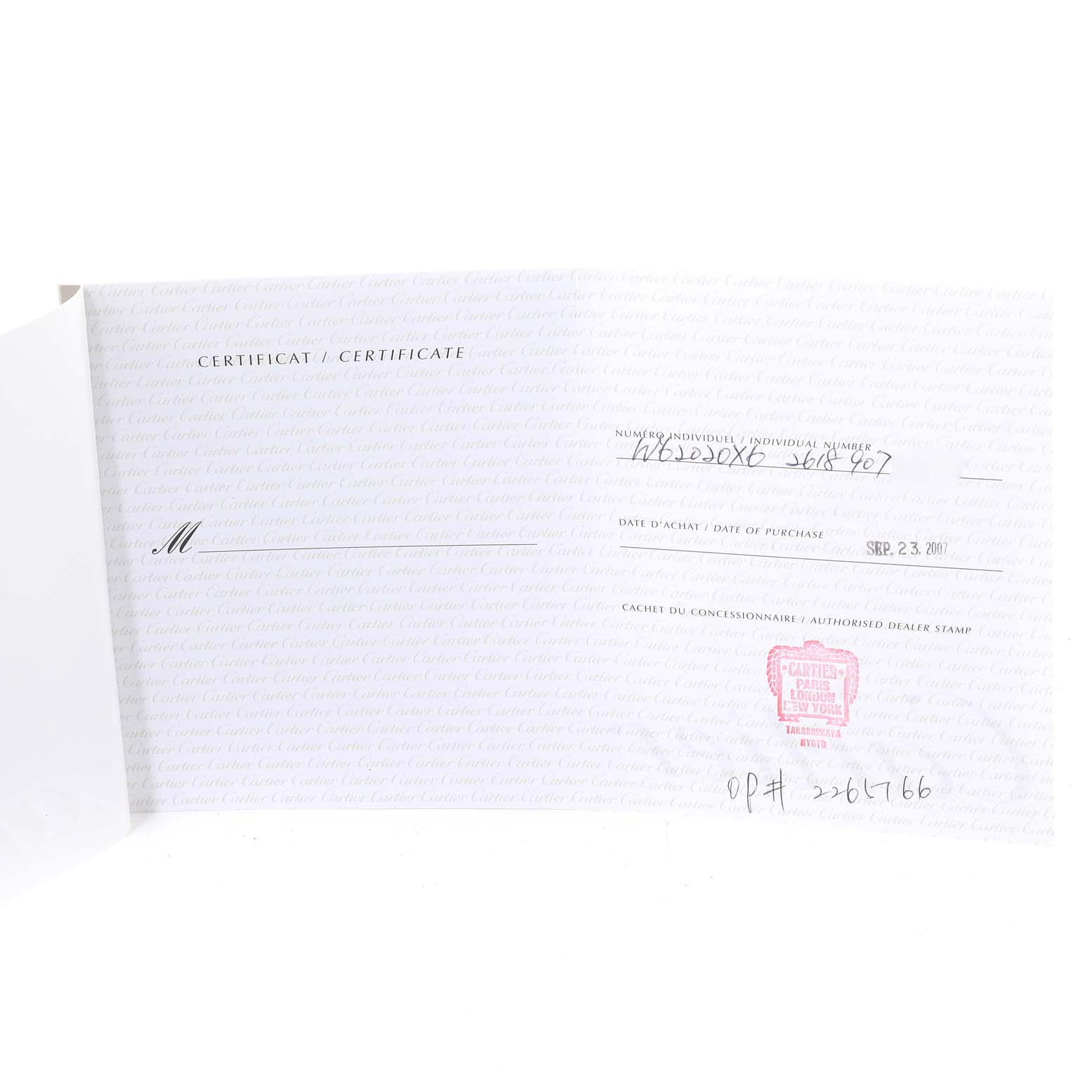 The image shows the certificate for the Cartier Roadster W62020X6 Men's Stainless Steel Black Dial W62020X6 Men's Stainless Steel Black Dial model watch, with purchase date and authorized dealer stamp visible.