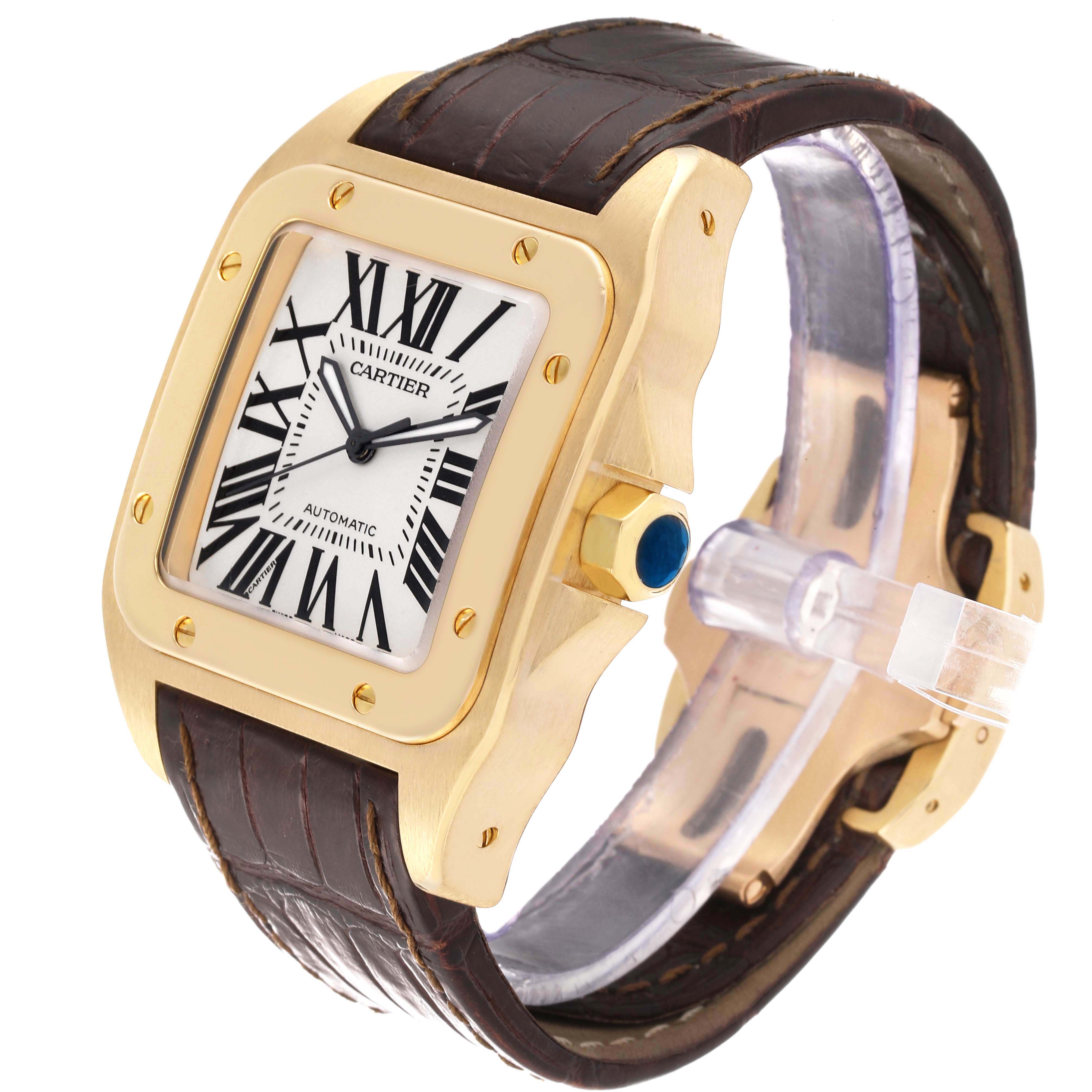 The image shows a Cartier Santos W20071Y1 Men's Yellow Gold Silver Dial W20071Y1 Men's Yellow Gold Silver Dial watch at an angle highlighting the gold case, Roman numeral dial, crown, and leather strap.