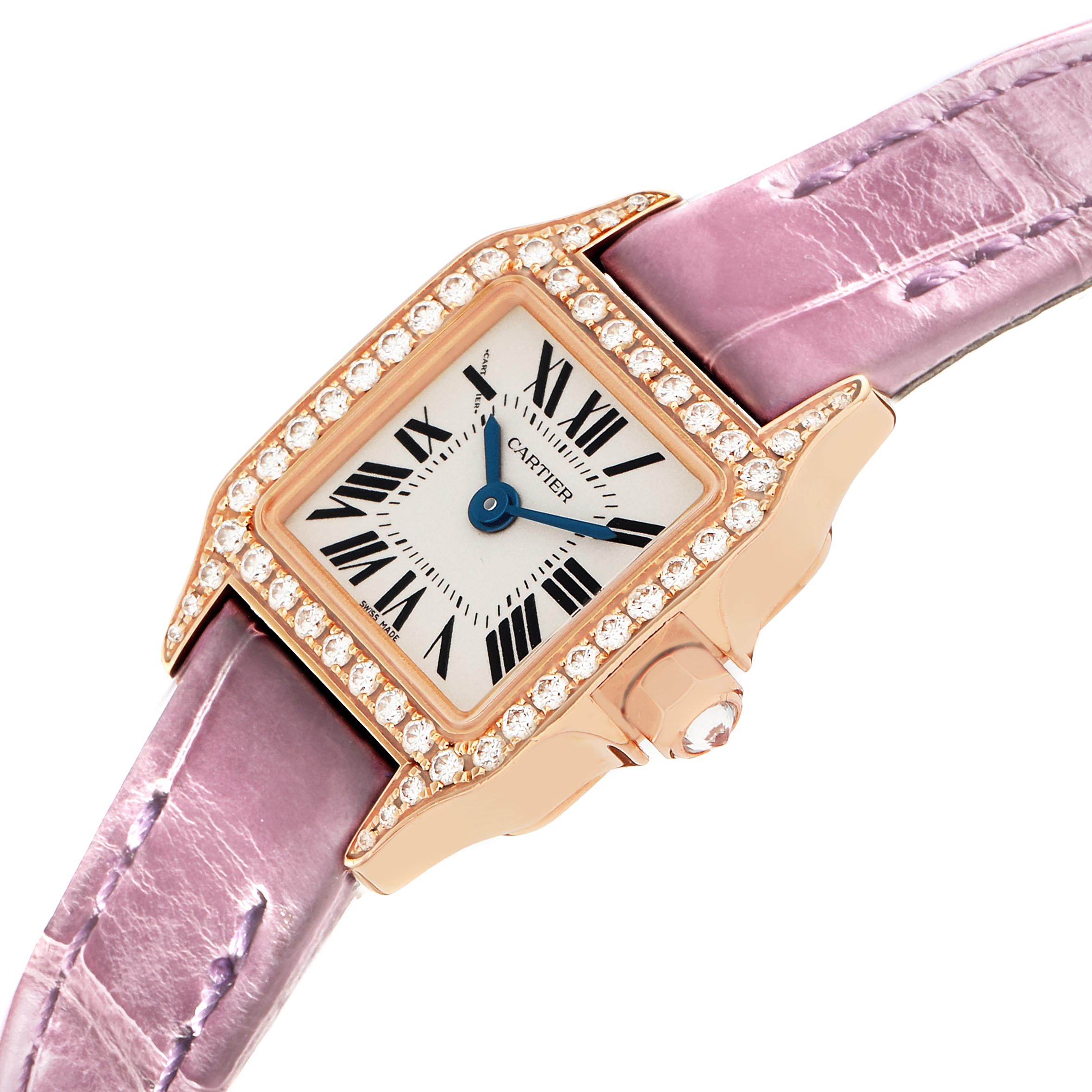 The Cartier Santos Demoiselle WF902004 Women
s Yellow Gold Silver Dial WF902004 Women
s Yellow Gold Silver Dial watch is shown at an angled view, highlighting its diamond-encrusted bezel and purple strap.