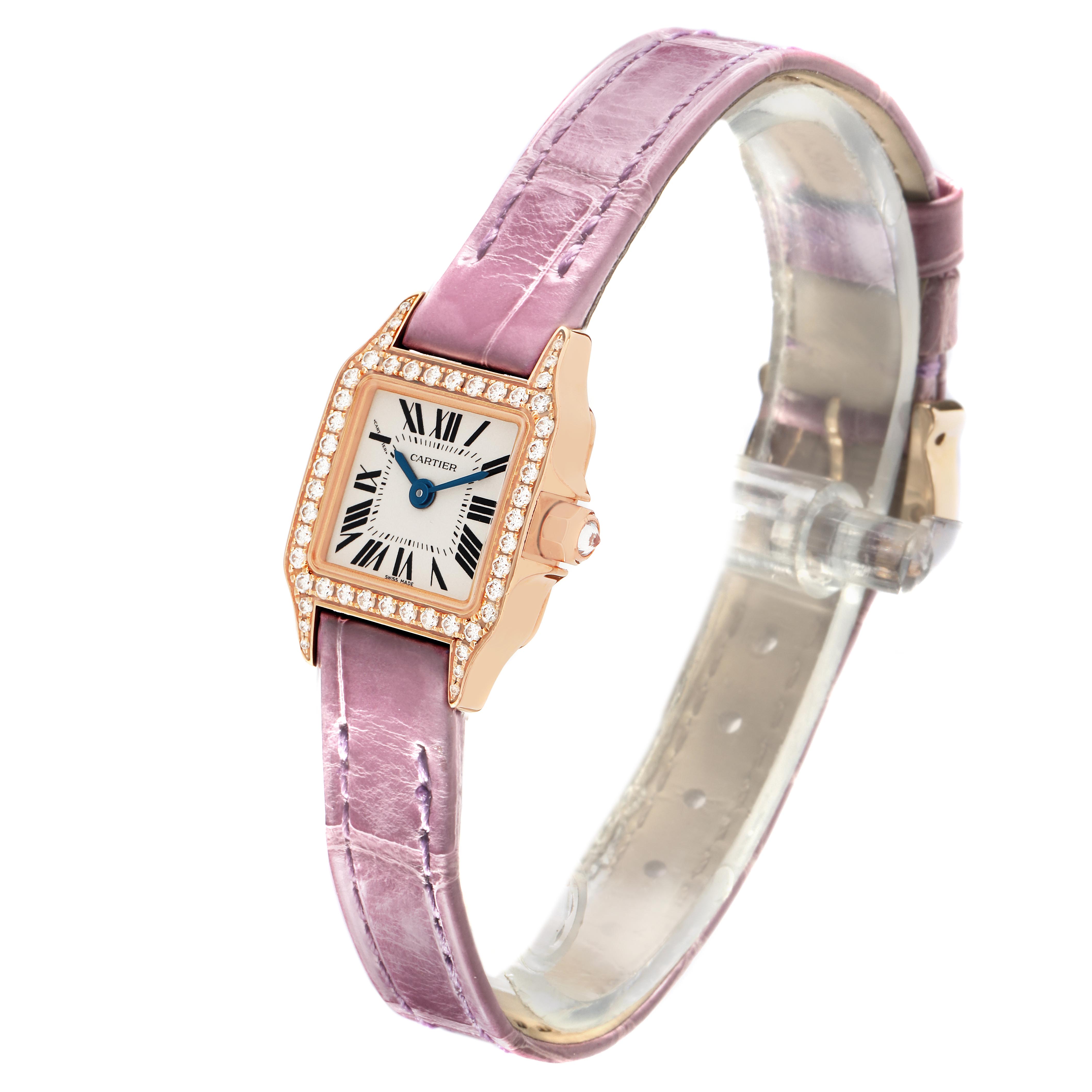 The Cartier Santos Demoiselle WF902004 Women
s Yellow Gold Silver Dial WF902004 Women
s Yellow Gold Silver Dial watch is shown from an angled side view, highlighting the case, bezel, dial, and strap.