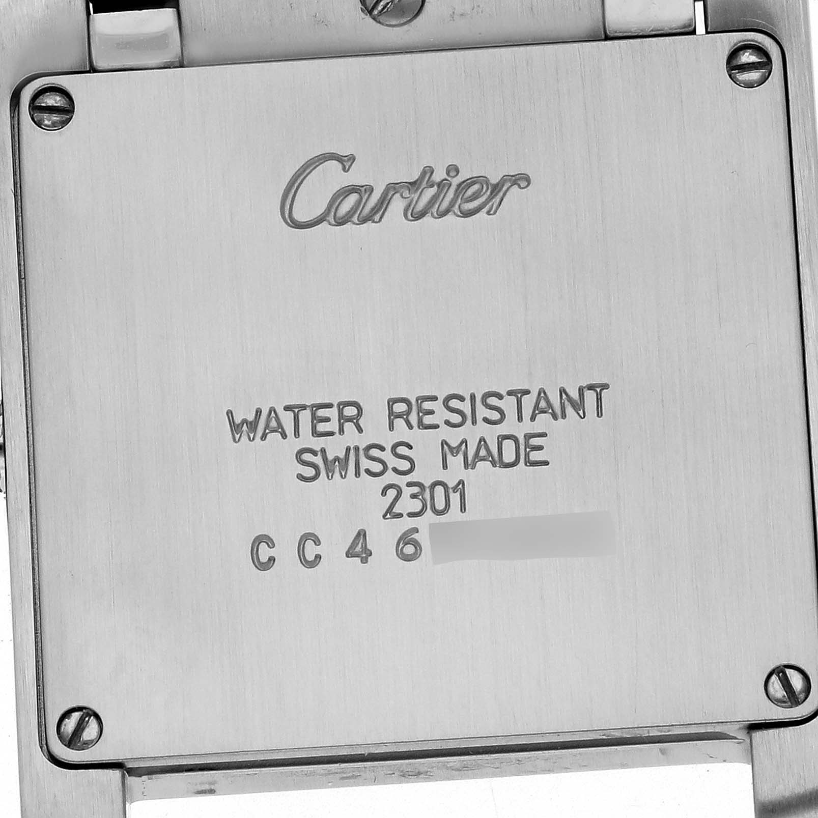 The image shows the back case of a Cartier Tank Francaise W51006Q4 Women's Steel and Gold (two tone) Silver Dial W51006Q4 Women's Steel and Gold (two tone) Silver Dial watch, highlighting the engraved text and serial number.