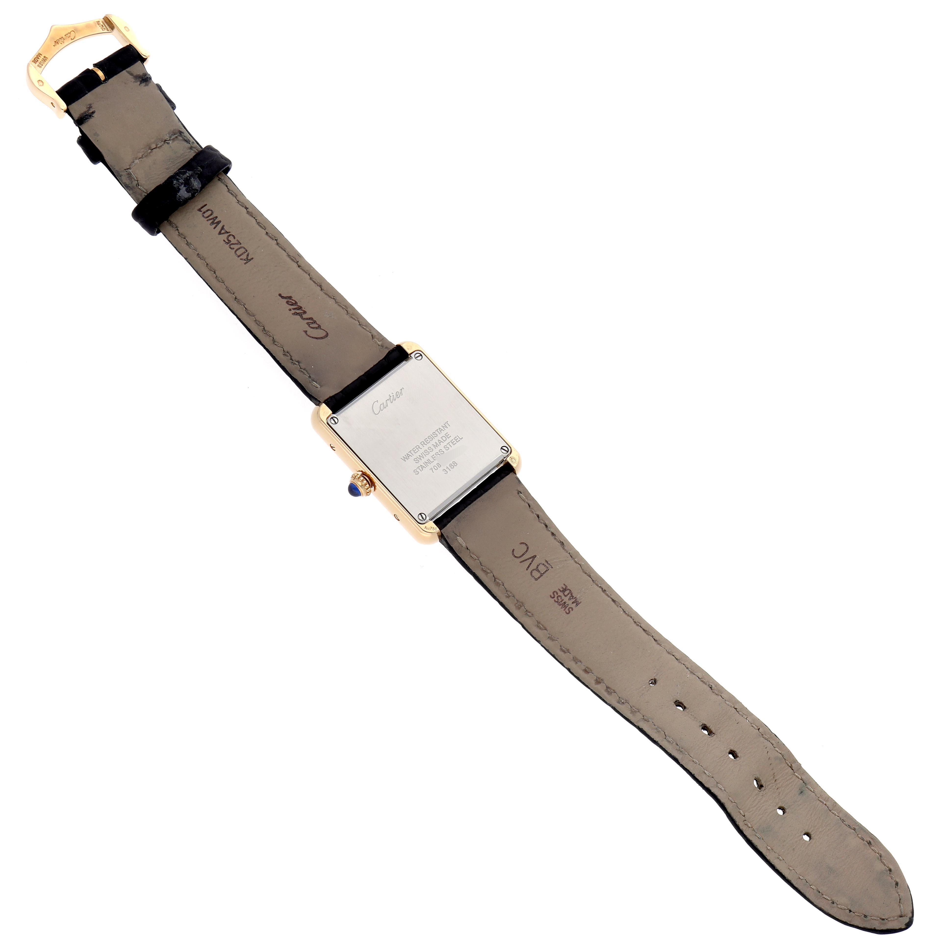 The Cartier Tank Solo W5200002 Women
s Steel and Gold (two tone) Silver Dial W5200002 Women
s Steel and Gold (two tone) Silver Dial watch is shown from the back, highlighting the case back, leather strap, and buckle.