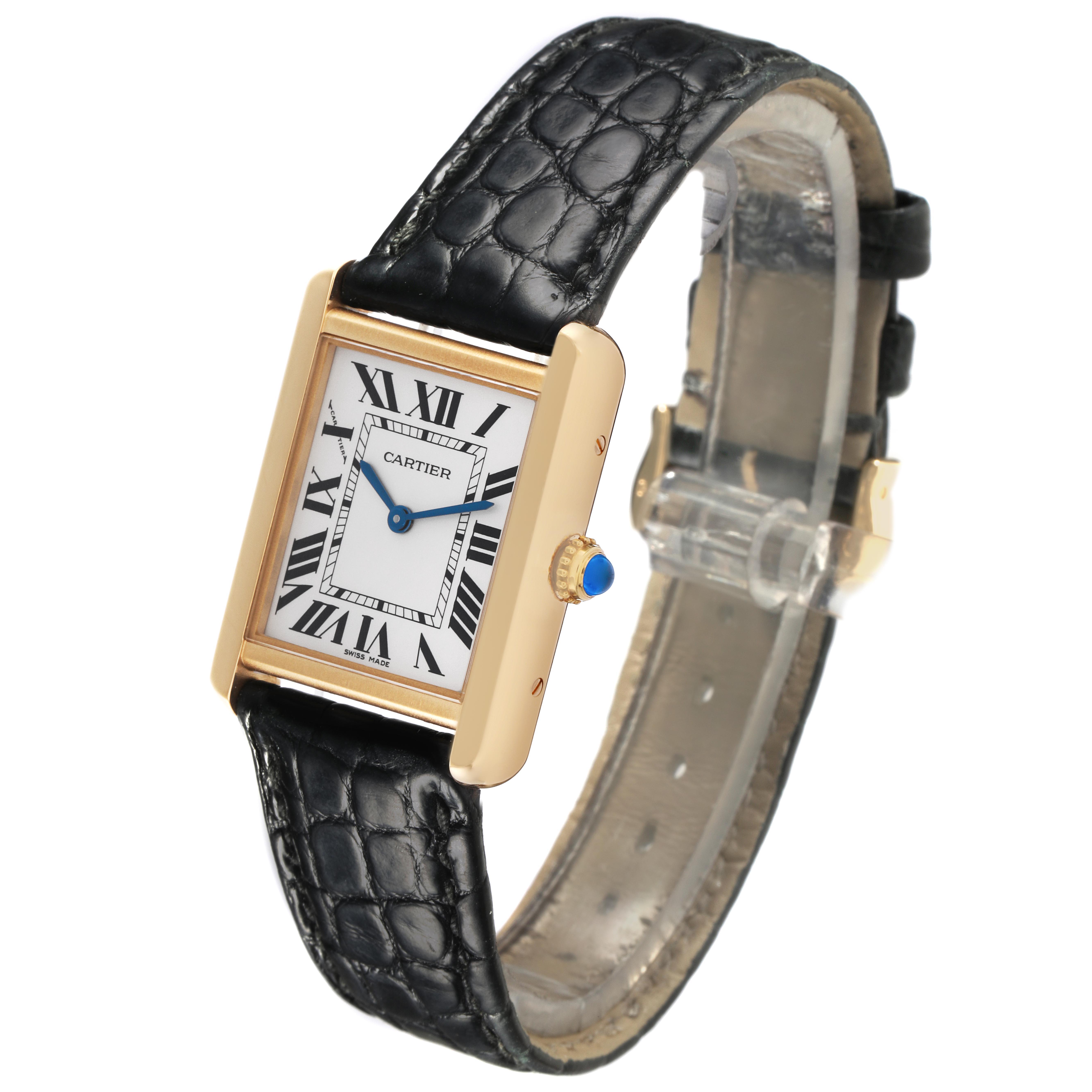 The Cartier Tank Solo W5200002 Women
s Steel and Gold (two tone) Silver Dial W5200002 Women
s Steel and Gold (two tone) Silver Dial watch is shown at a three-quarter angle, highlighting the rectangular face, Roman numerals, blue hands, and black leather strap.