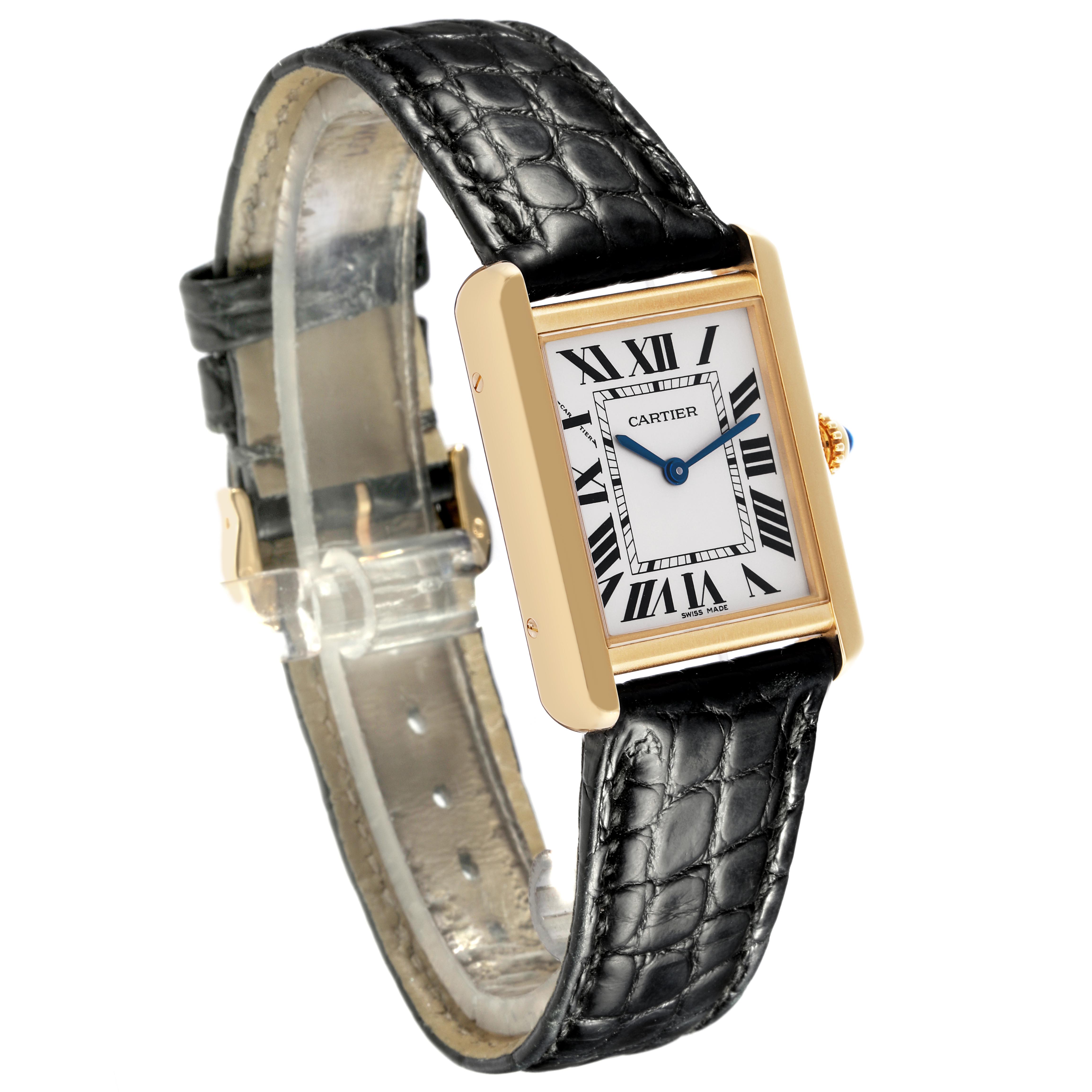 The Cartier Tank Solo W5200002 Women
s Steel and Gold (two tone) Silver Dial W5200002 Women
s Steel and Gold (two tone) Silver Dial watch is shown at a three-quarter angle, displaying its rectangular face, Roman numerals, and black leather strap.