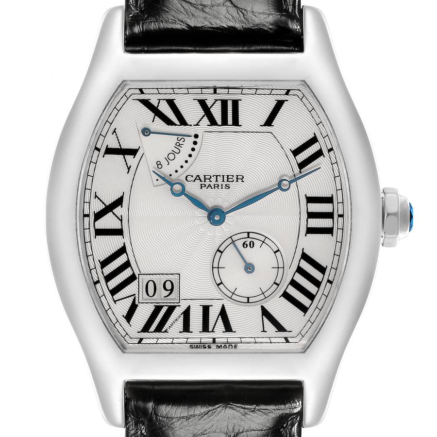 The Tortue model by Cartier is shown from a front angle, highlighting its face, Roman numerals, and leather strap.