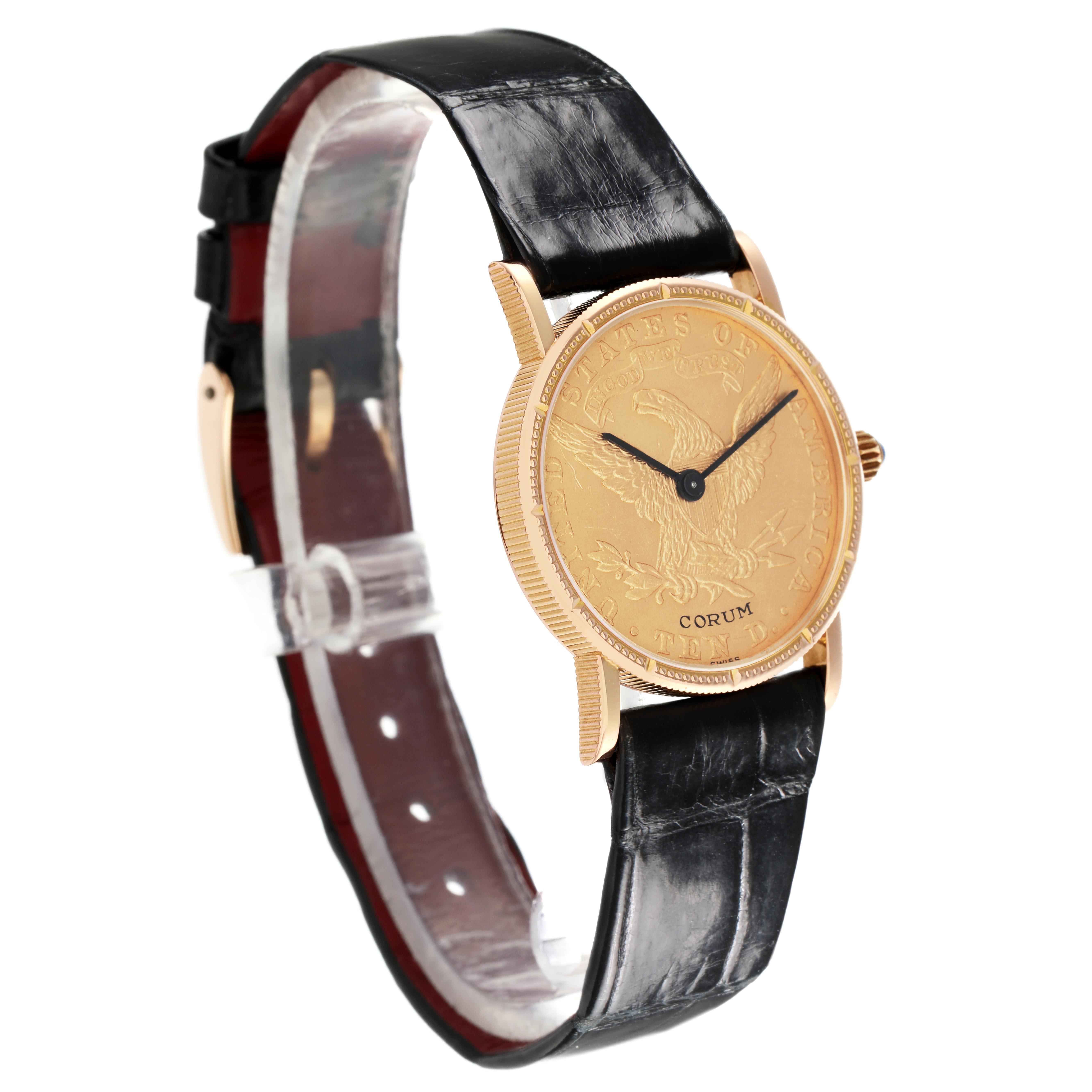 The Corum Coin Watch Men
s Yellow Gold Champagne Dial Men
s Yellow Gold Champagne Dial model is shown at a three-quarter angle, displaying its gold coin face, black hands, and black leather strap.