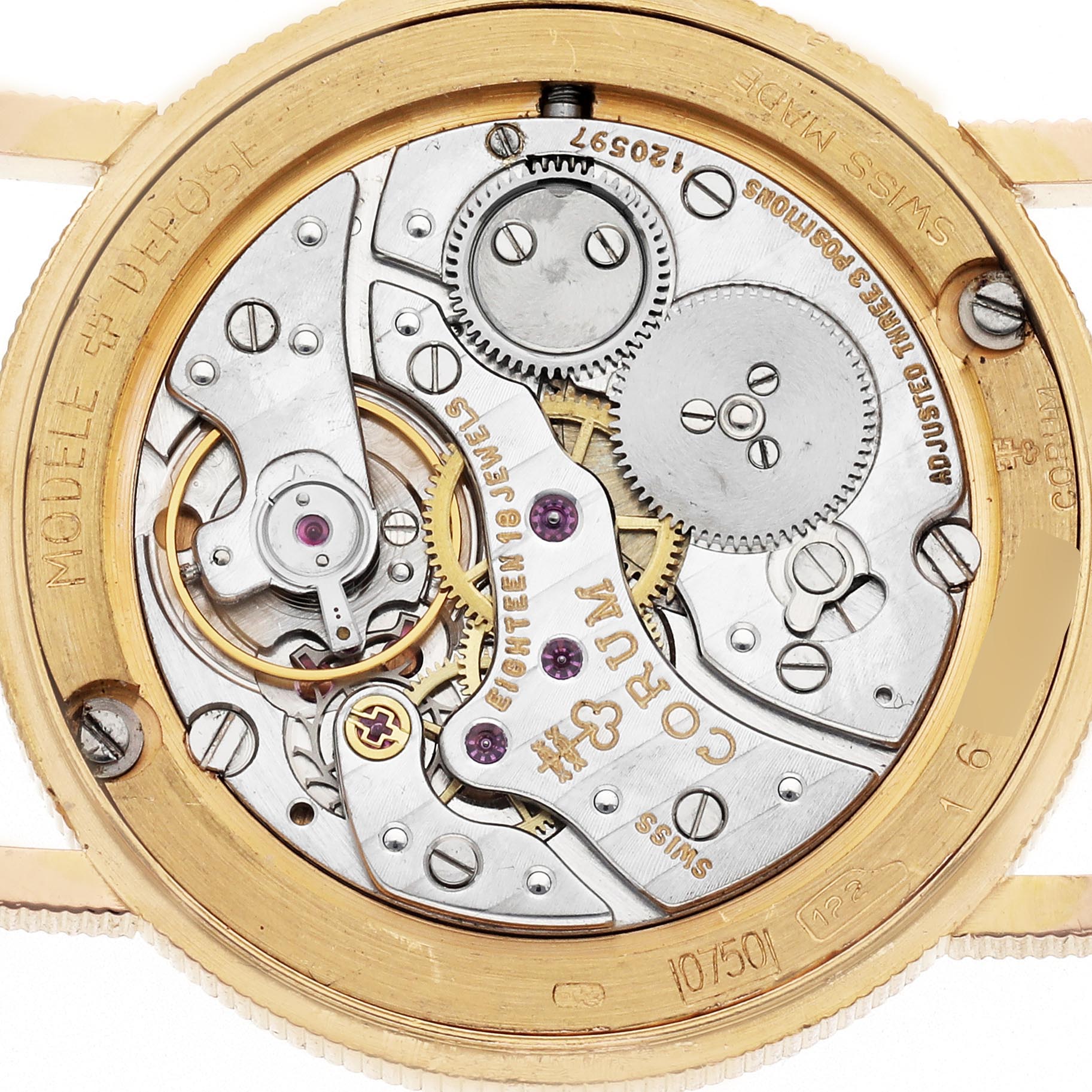 The Corum Coin Watch Men
s Yellow Gold Champagne Dial Men
s Yellow Gold Champagne Dial is shown from the back, revealing its mechanical movement with gears and engravings.
