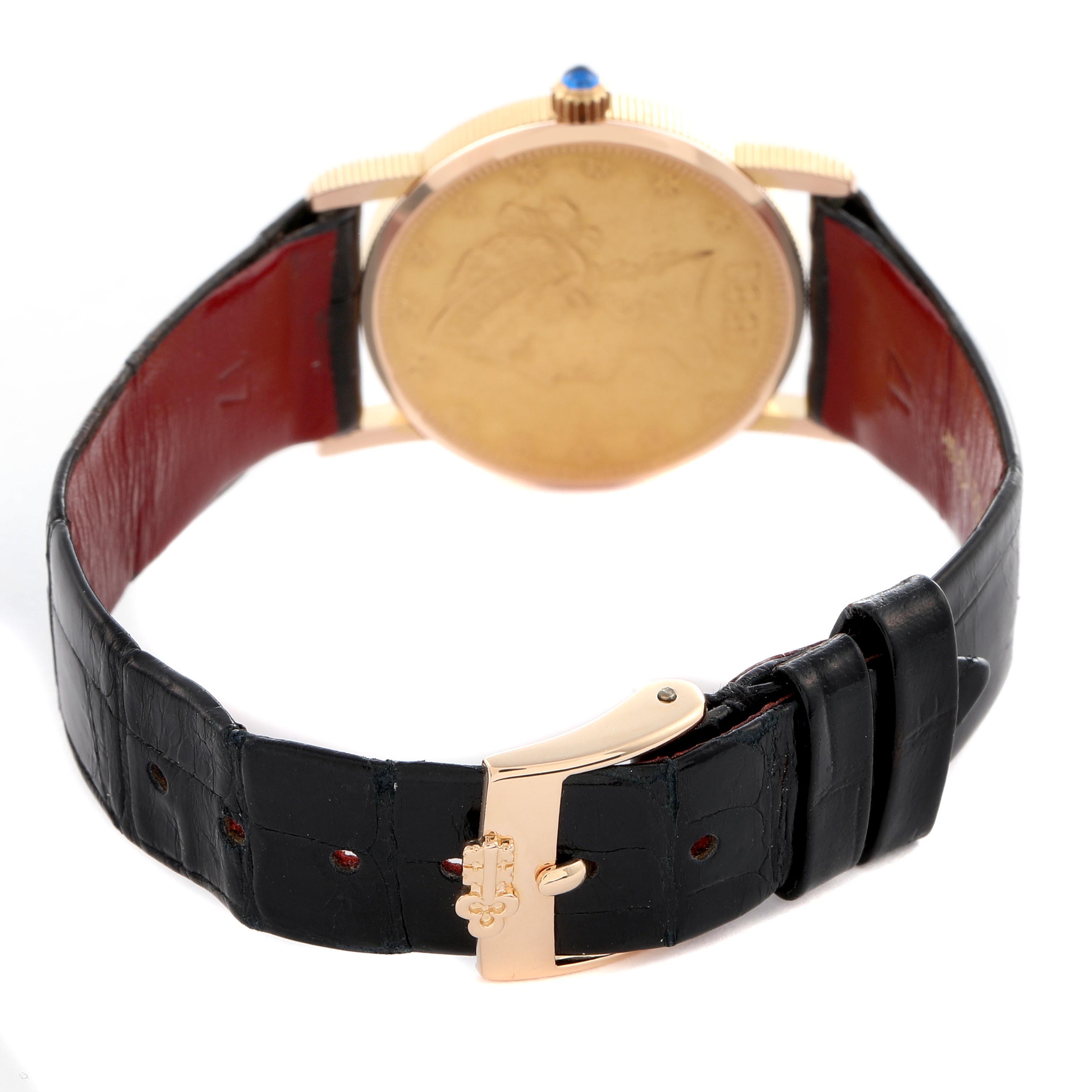 The Corum Coin Watch Men
s Yellow Gold Champagne Dial Men
s Yellow Gold Champagne Dial is shown from the back, highlighting its caseback, crown, and clasp on a black leather strap.