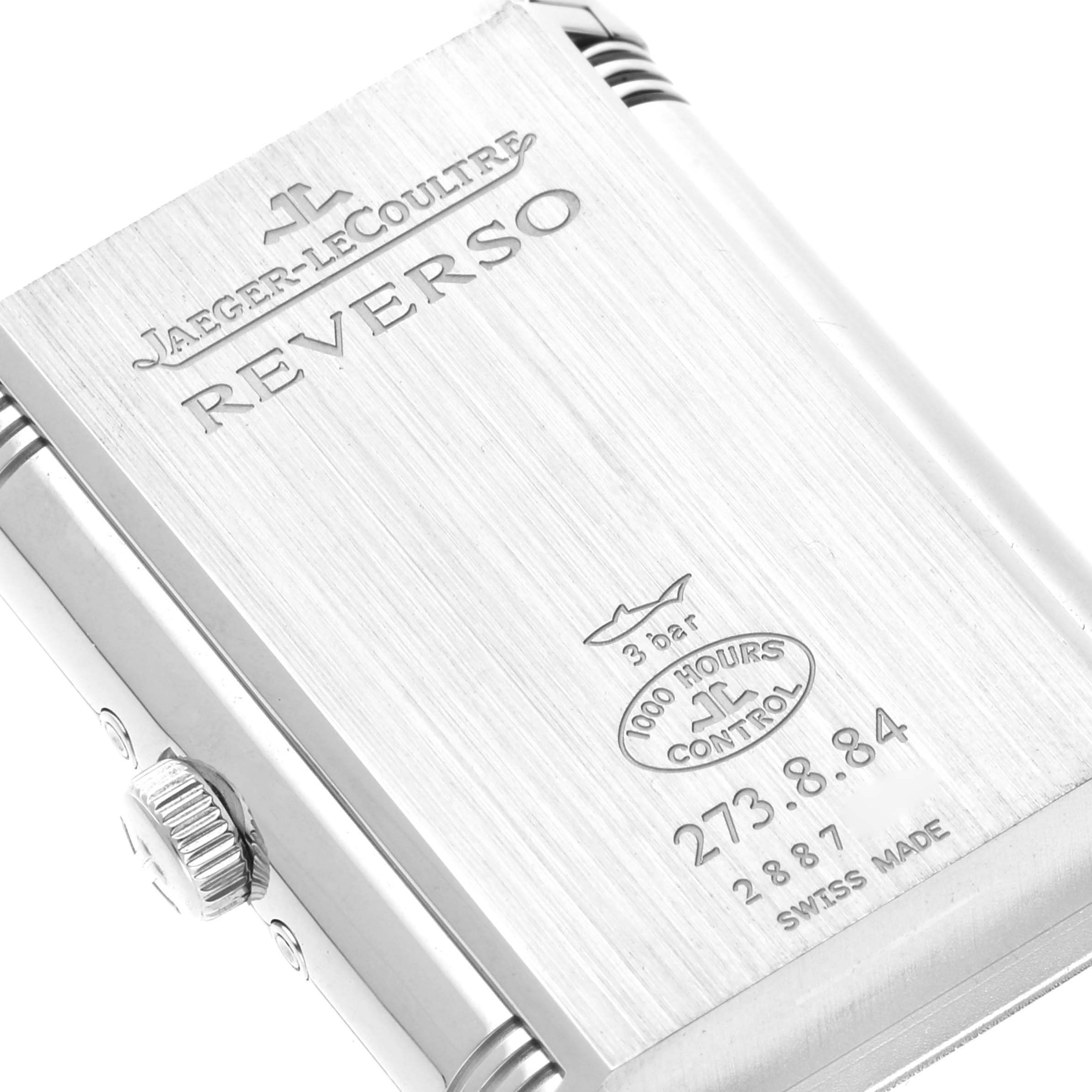 This image shows the back of a Jaeger-LeCoultre Reverso watch case engraved with branding and specifications.