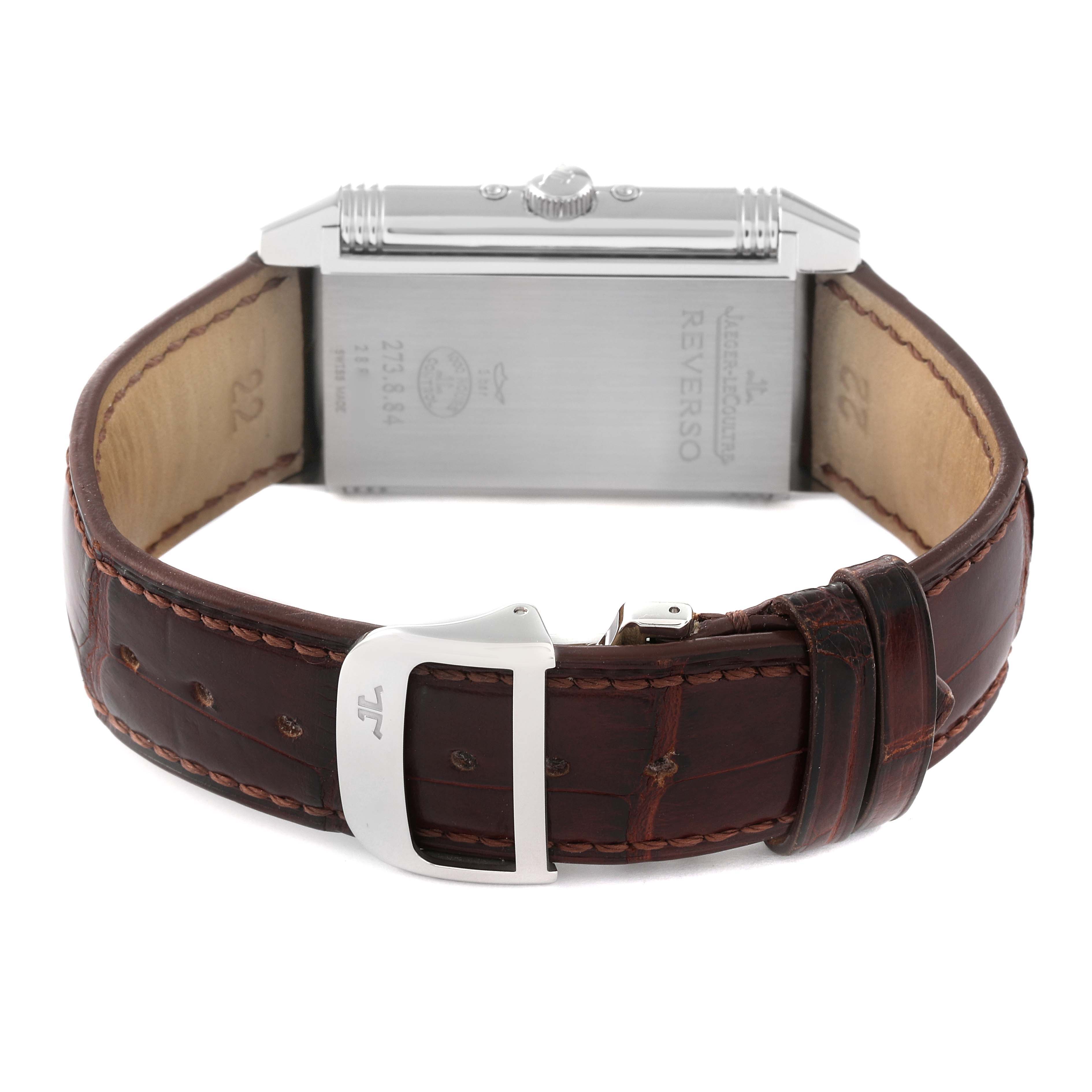 The image shows the back view of the Jaeger LeCoultre Reverso Q3758420 Men
s Stainless Steel Silver Dial Q3758420 Men
s Stainless Steel Silver Dial watch, highlighting the case back, crown, and leather strap with the buckle.
