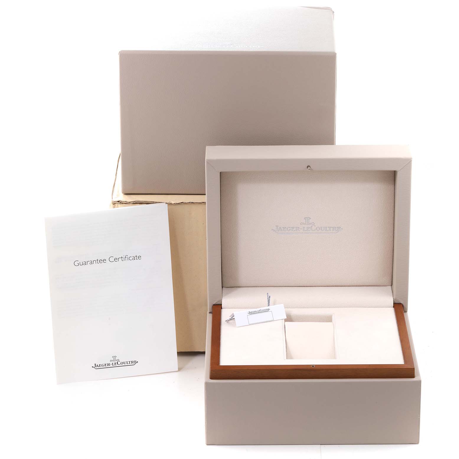 The image shows the packaging and accessories for a Jaeger LeCoultre Reverso Q3758420 Men
s Stainless Steel Silver Dial Q3758420 Men
s Stainless Steel Silver Dial watch, including the box and guarantee certificate.