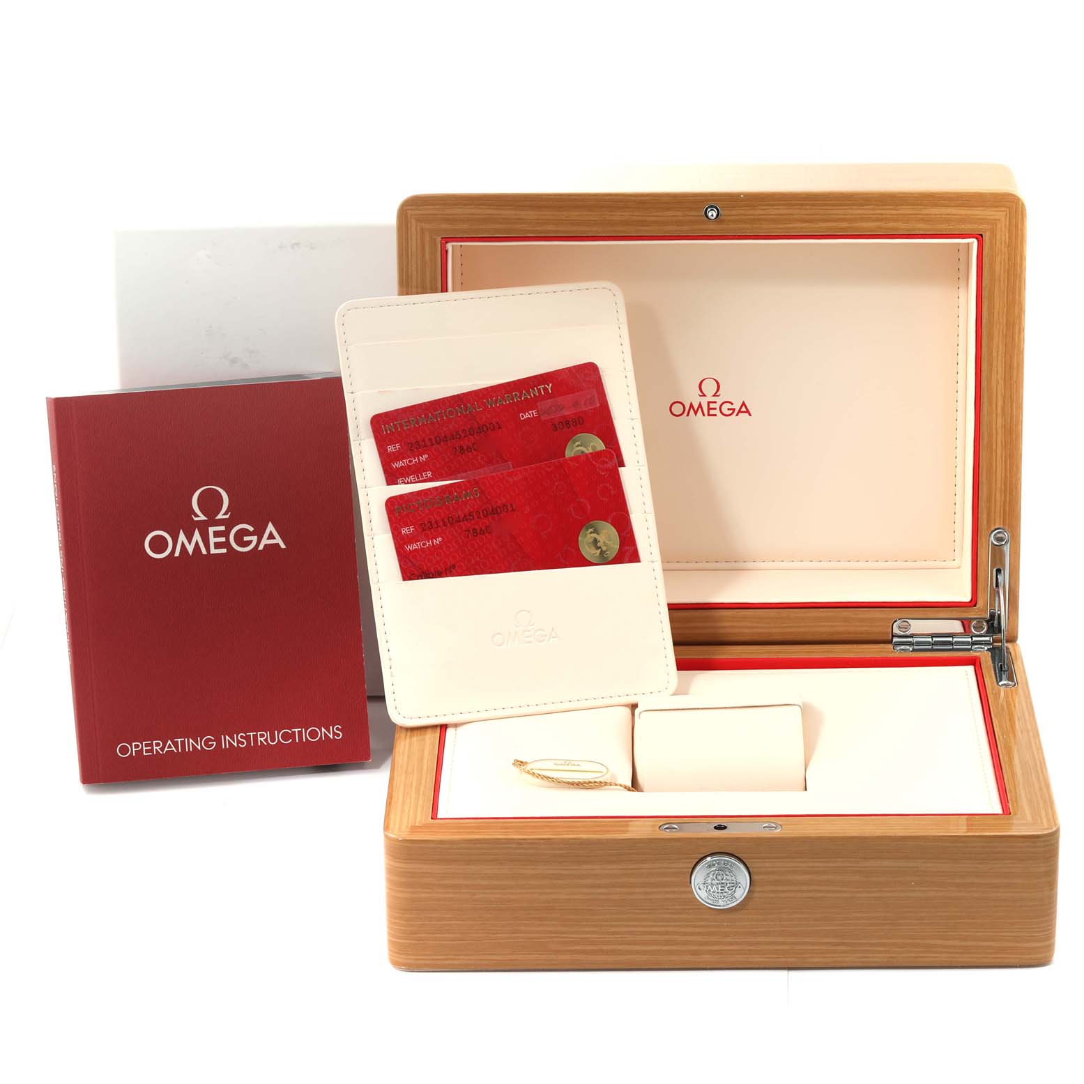 The image shows the Omega Seamaster 231.10.44.52.04.001 Men
s Stainless Steel White Dial 231.10.44.52.04.001 Men
s Stainless Steel White Dial watch box, warranty cards, and an operating instructions booklet, all from a straight angle.