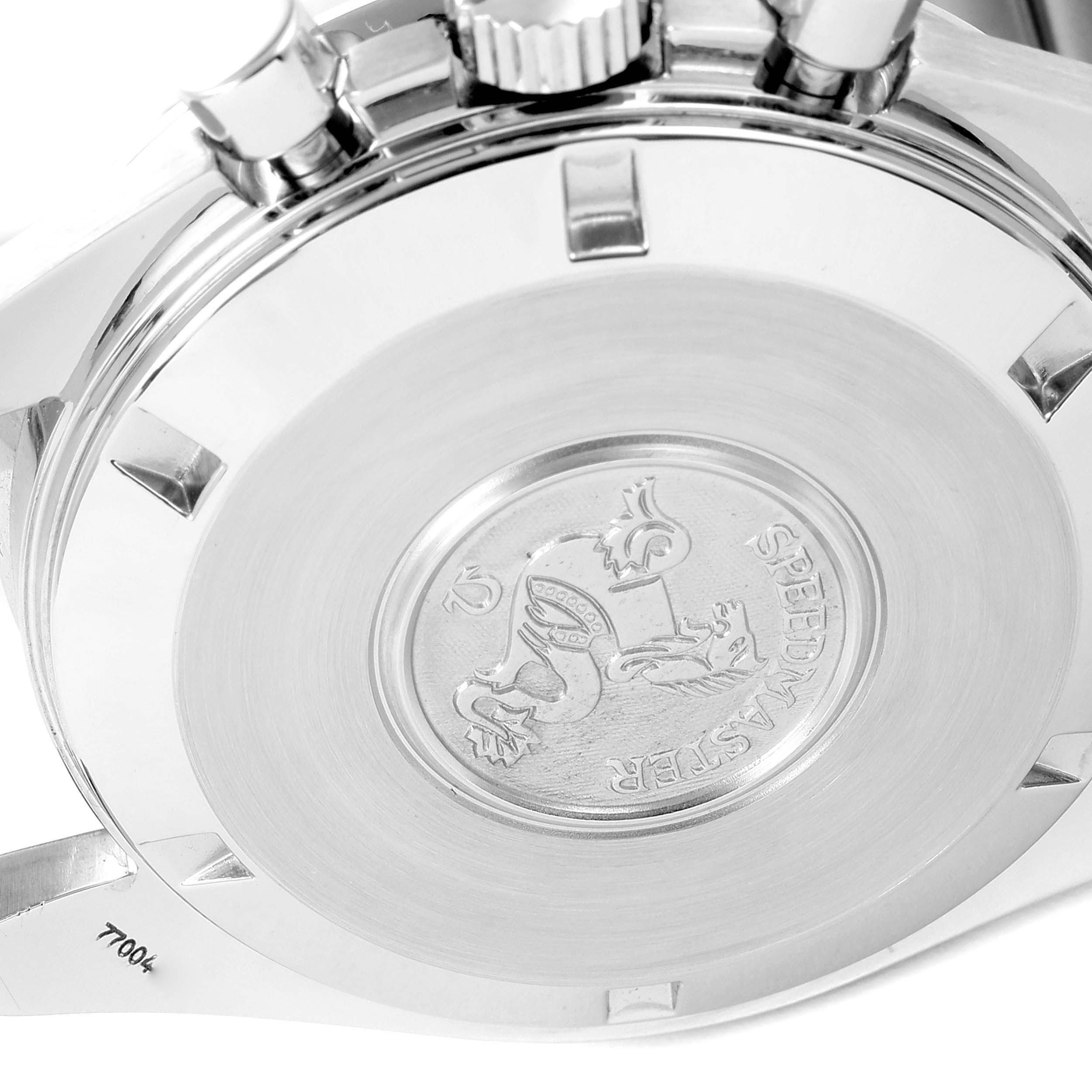 The image shows the case back of an Omega Speedmaster 3594.50.00 Men
s Stainless Steel Black Dial 3594.50.00 Men
s Stainless Steel Black Dial watch with engraved details and partial crown and pushers visible.