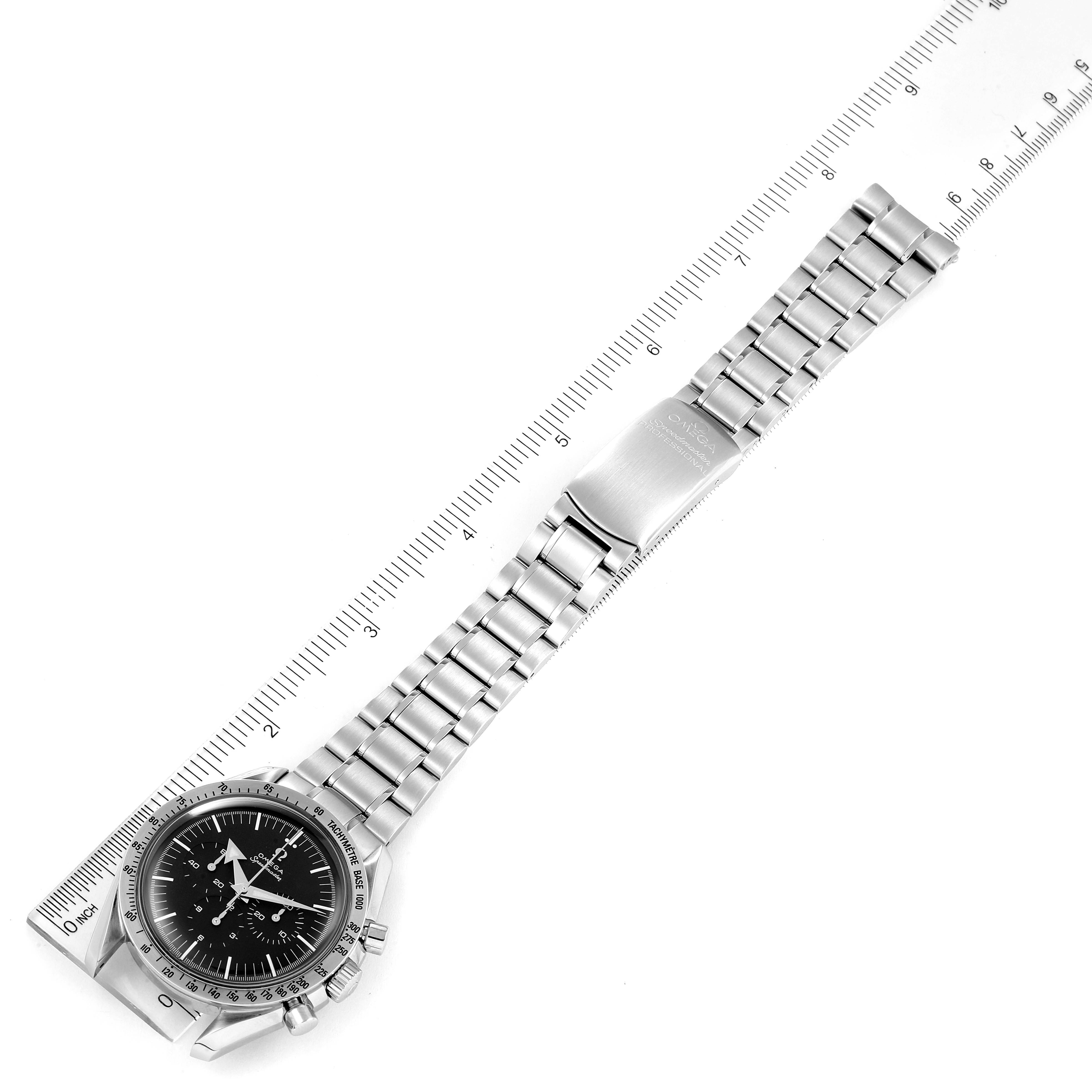 The Omega Speedmaster 3594.50.00 Men
s Stainless Steel Black Dial 3594.50.00 Men
s Stainless Steel Black Dial watch is shown lying flat with its bracelet extended alongside a ruler for measurement.