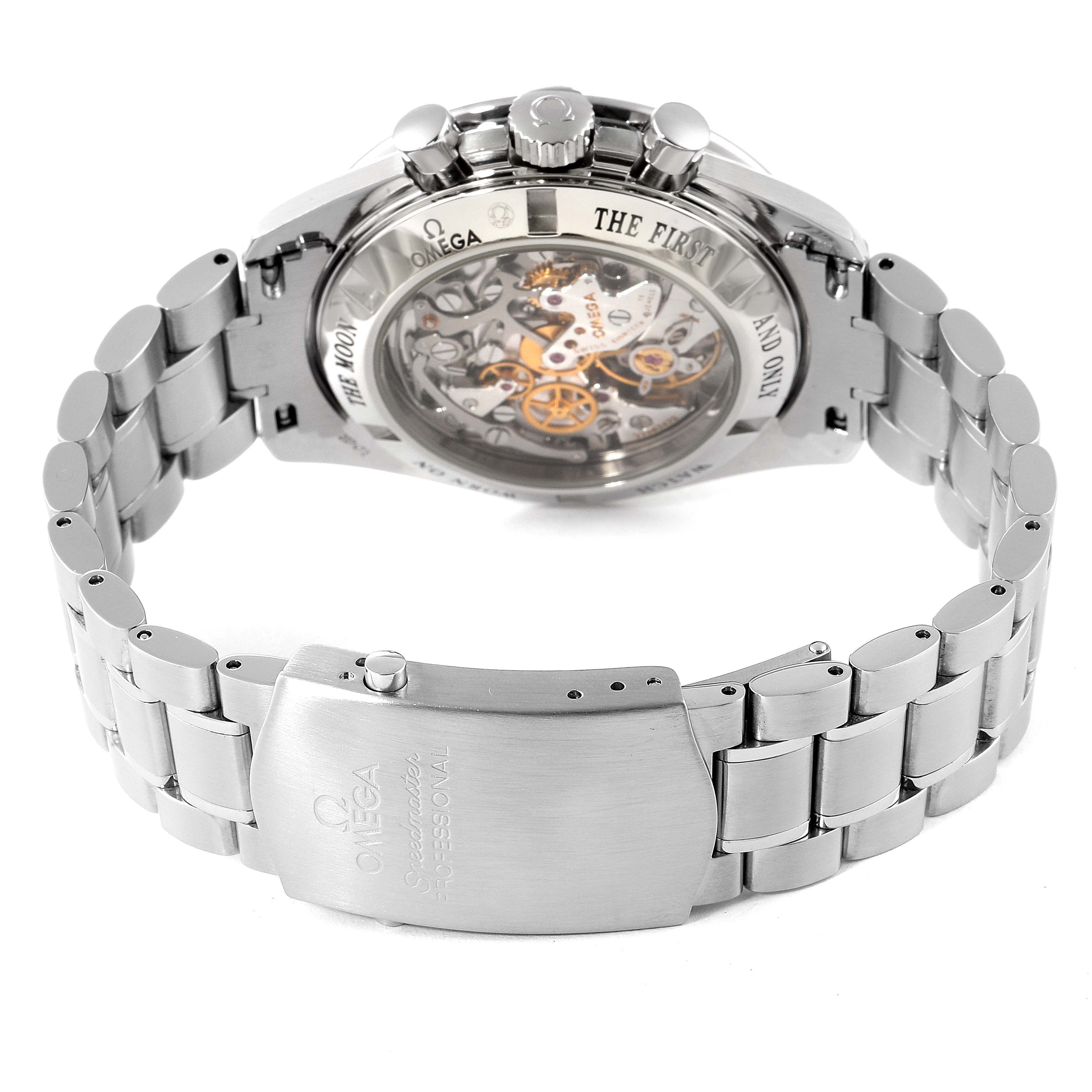 The image shows the back view of an Omega Speedmaster 3573.50.00 Men
s Stainless Steel Black Dial 3573.50.00 Men
s Stainless Steel Black Dial watch, highlighting its transparent case back and metal bracelet clasp.