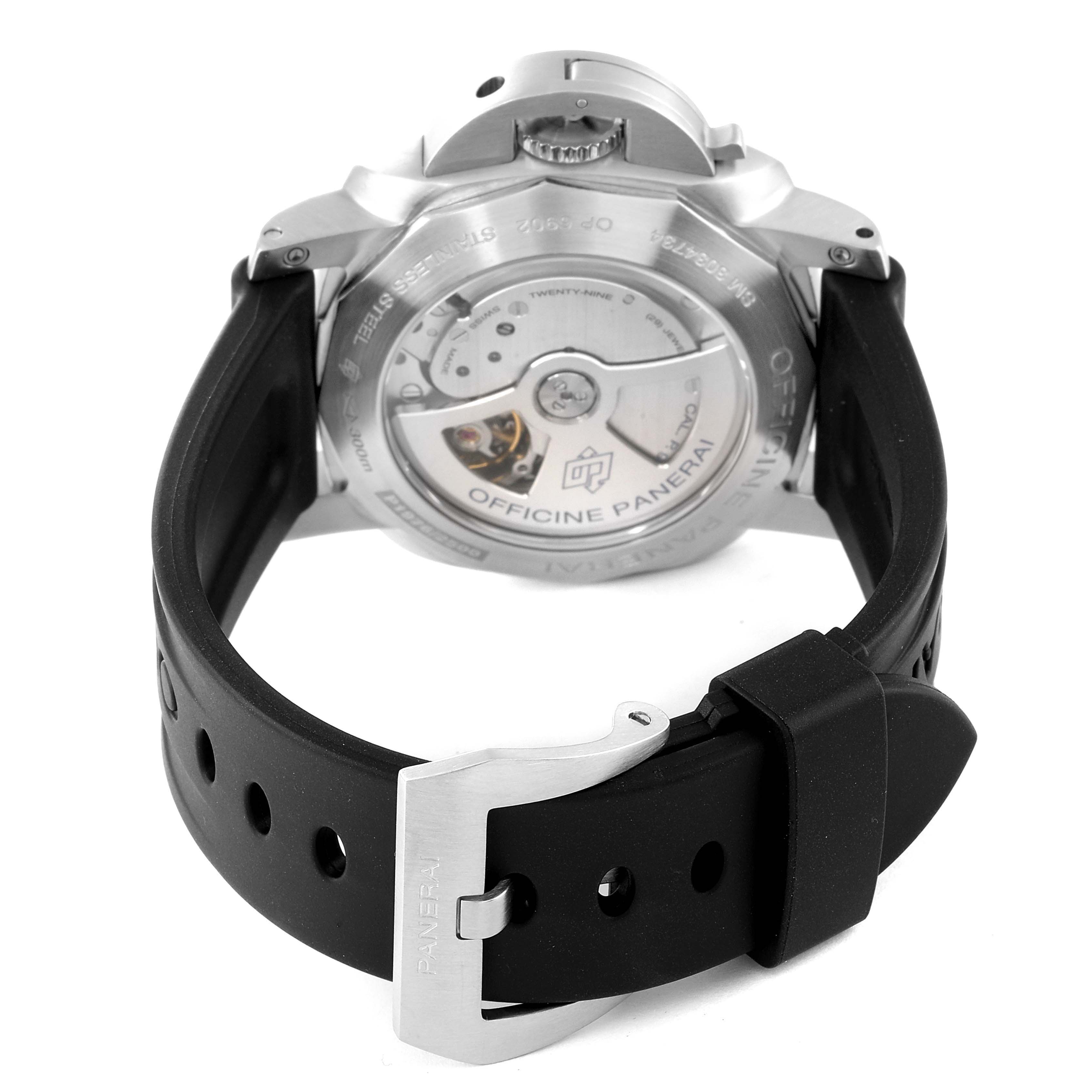 The image shows the back view of the Panerai Luminor PAM00321 Men's Stainless Steel Black Dial PAM00321 Men's Stainless Steel Black Dial watch, displaying its case back and movement with a black rubber strap and buckle.