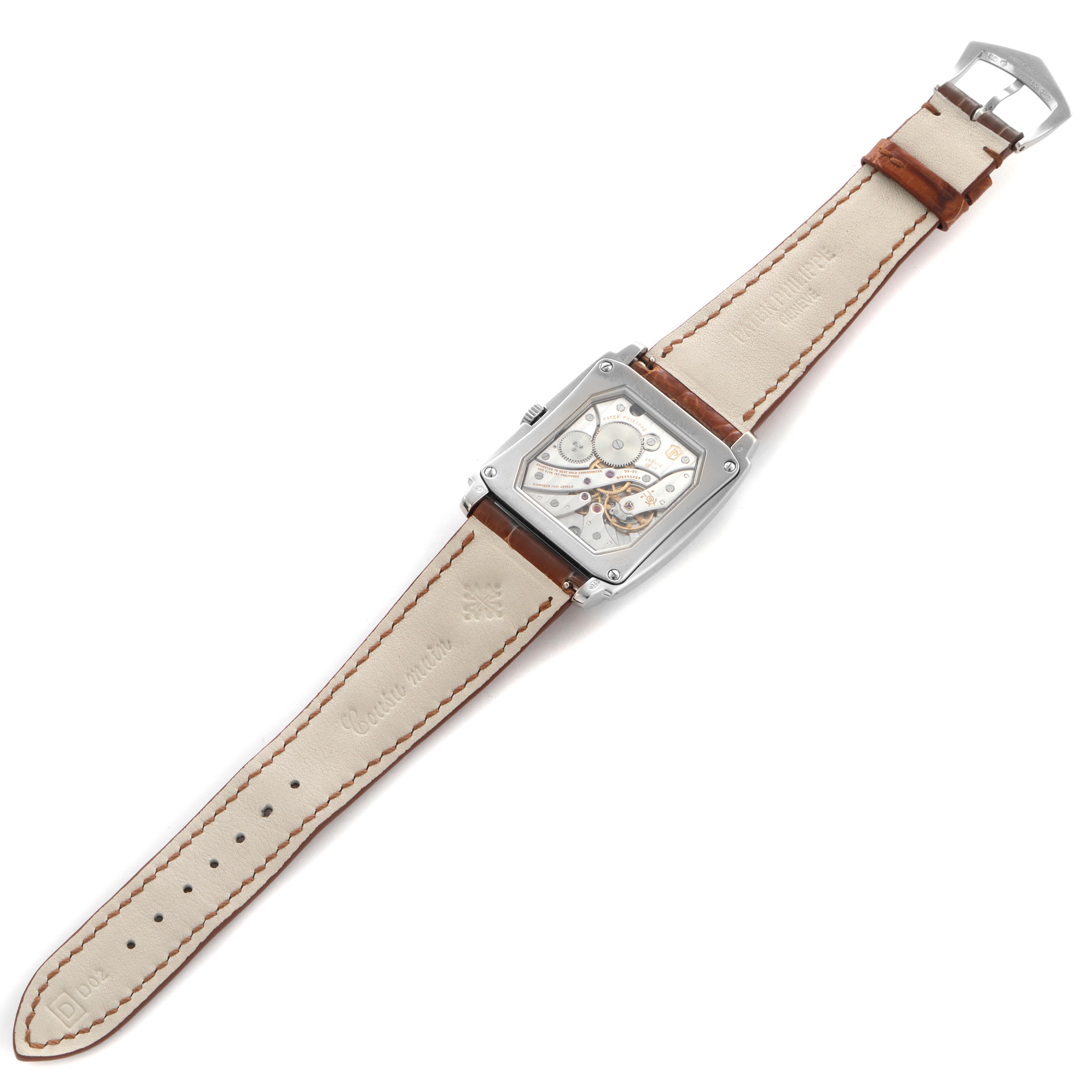 The Patek Philippe Gondolo 5124G-001 Men
s White Gold Brown Dial 5124G-001 Men
s White Gold Brown Dial watch is viewed from the back, showing the movement and cream leather strap.