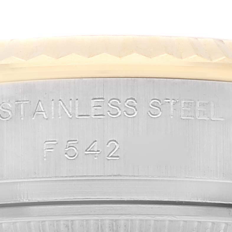 The image shows a close-up angle of the case back edge of a Rolex Datejust 179173 Women's Steel and Gold (two tone) Silver Dial 179173 Women's Steel and Gold (two tone) Silver Dial watch, highlighting the "STAINLESS STEEL" engraving.